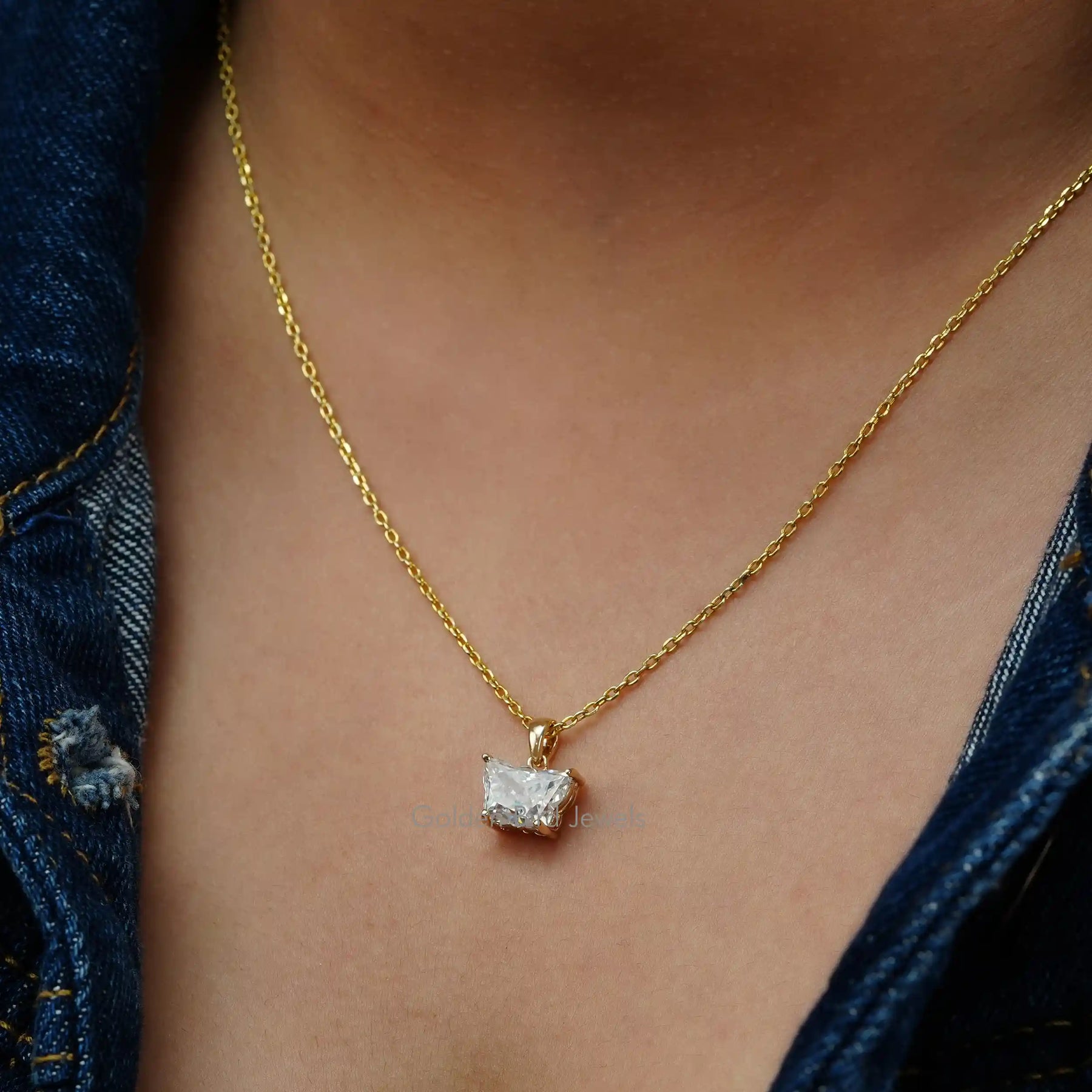 Front view of yellow gold butterfly cut pendant