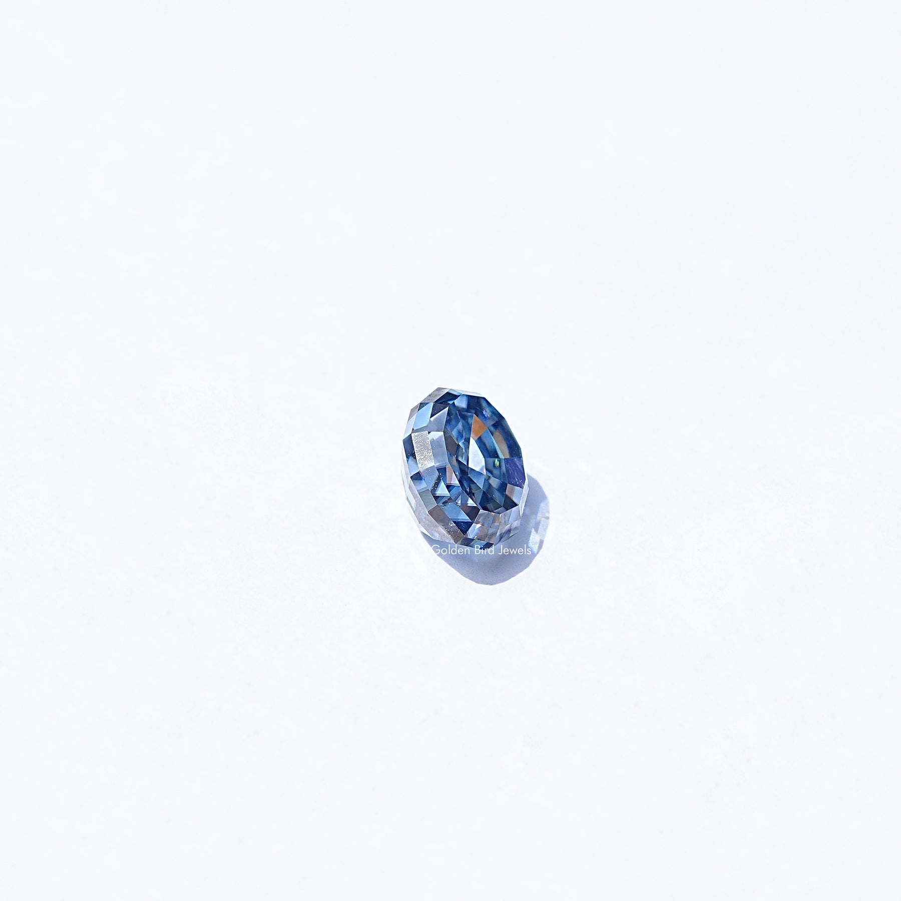 View of 2.10 Carat Step Cut Oval Loose Moissanite In Blue