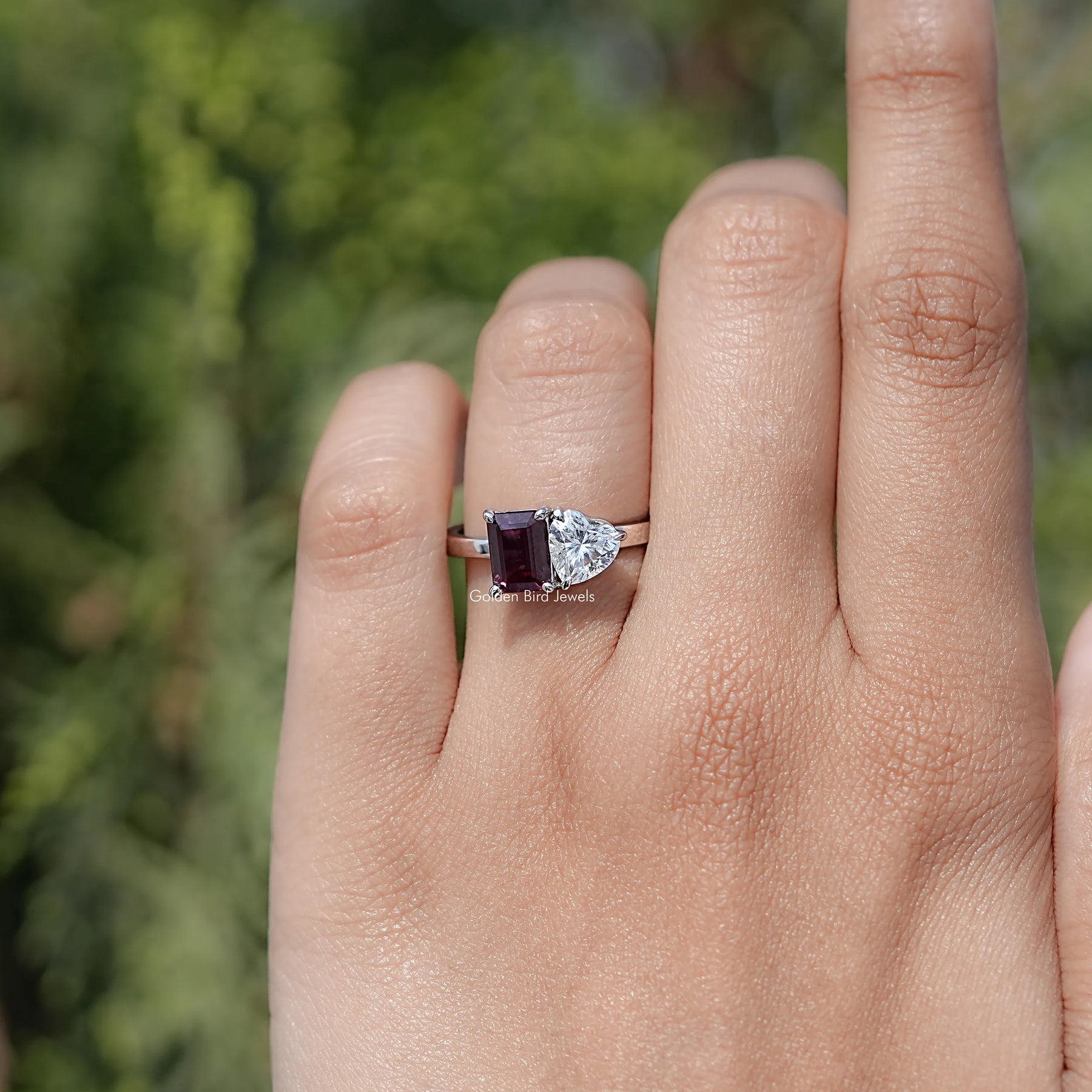 In finger view of Heart Cut Moissanite Solitaire Ring