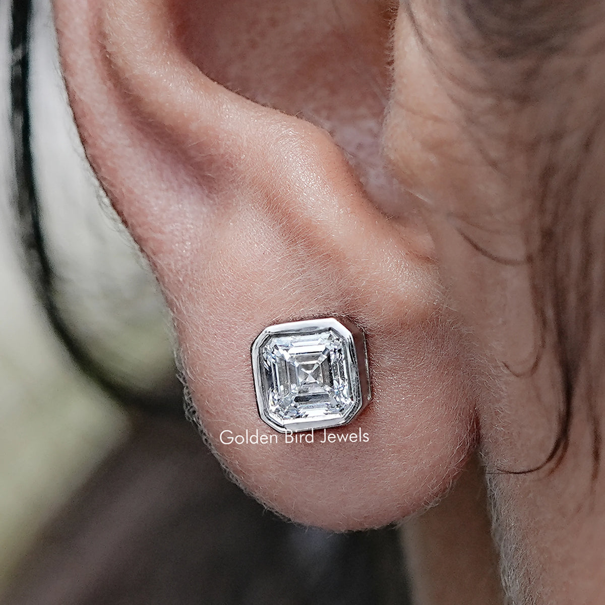 Close up view of Asscher Cut Lab Diamond Bezel Set Stud Earrings