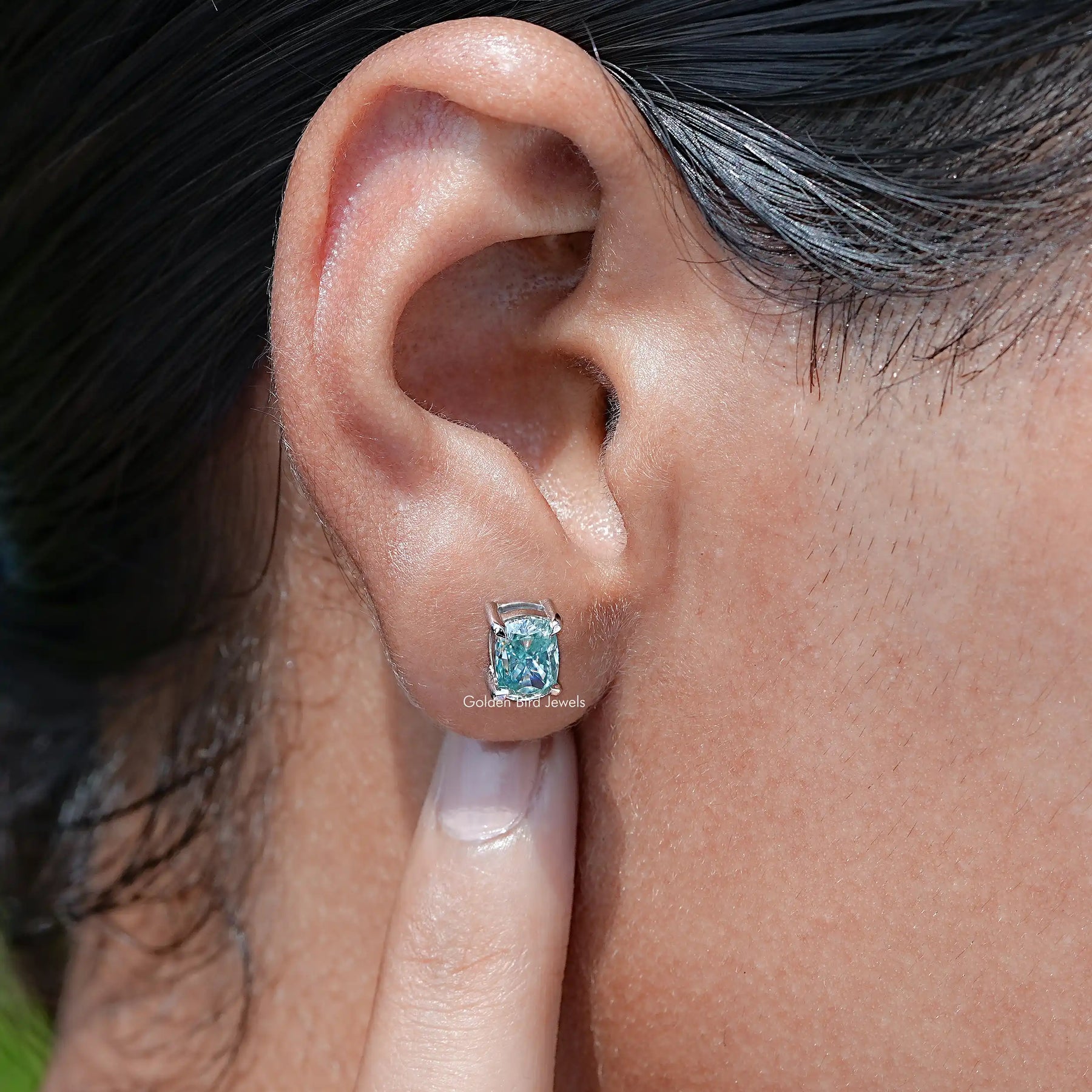 Front view of Solid Blue elongated cushion Cut moissanite Stud Earrings