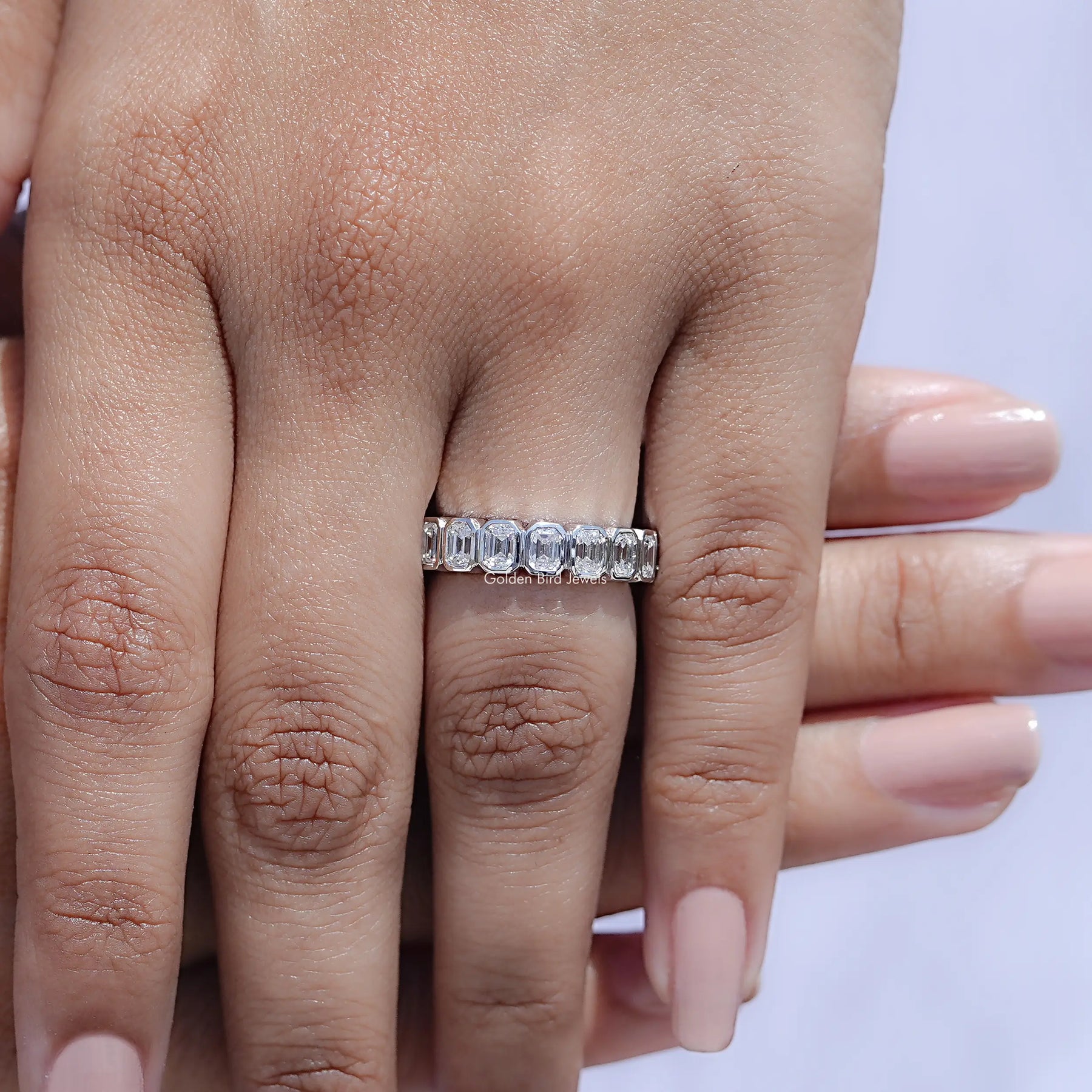 View of Bezel Set Emerald Cut Full Eternity Band in prongs setting