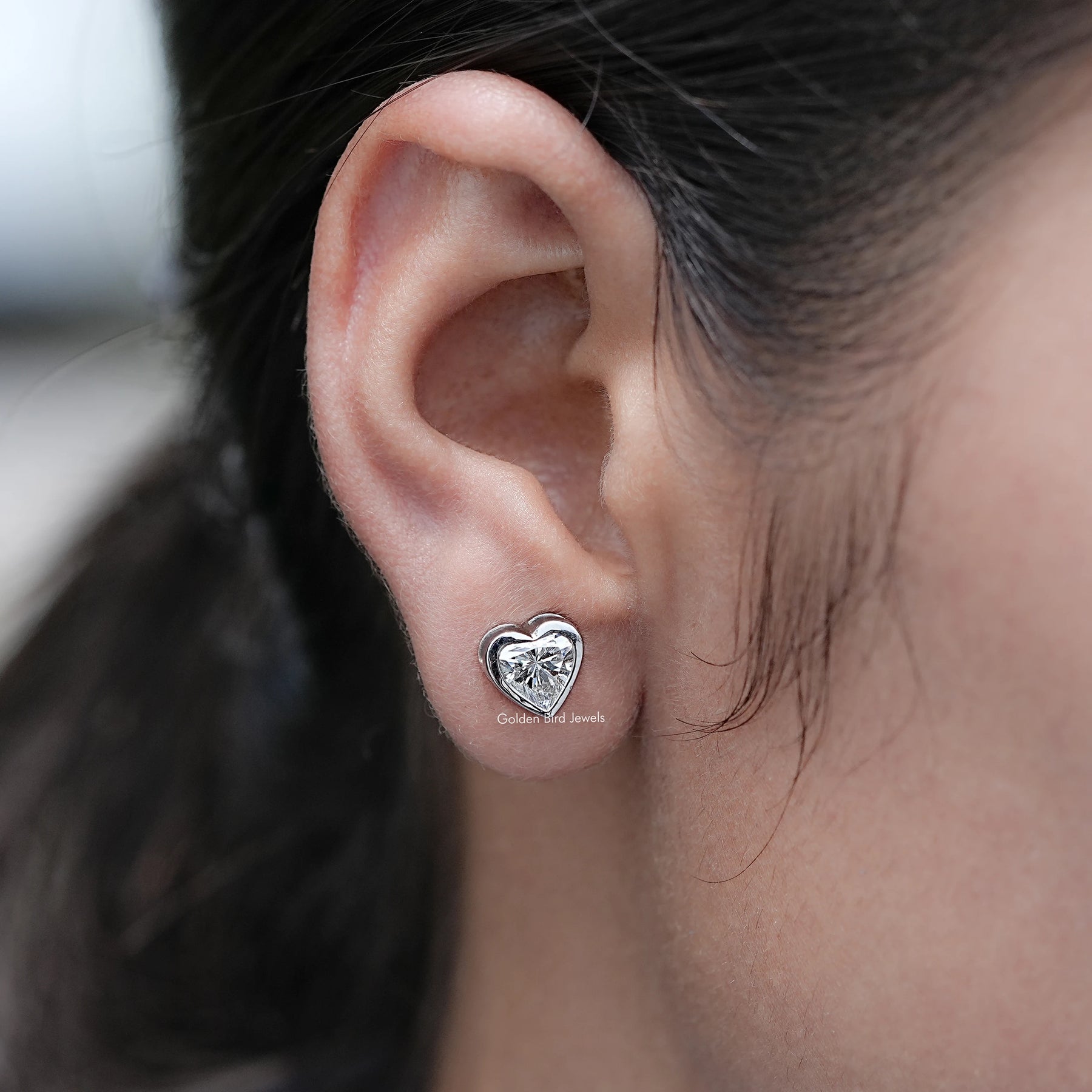 Side View of Heart Shaped Lab Diamond Stud Earrings in Ear