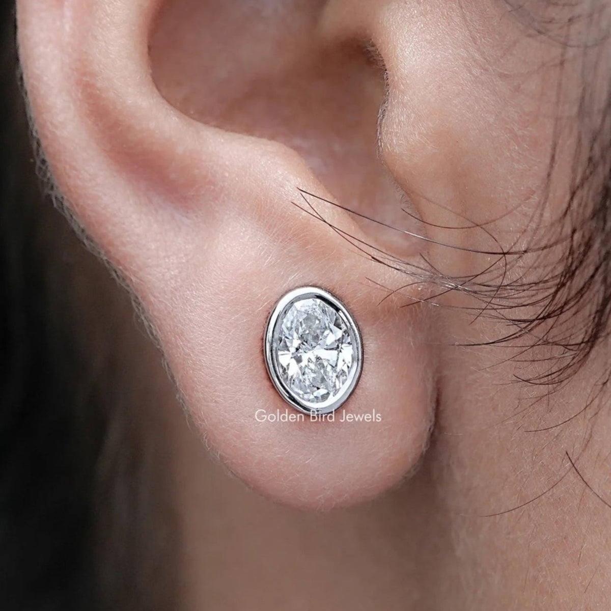 Close up view of Bezel Set Oval Lab Diamond Stud Earrings
