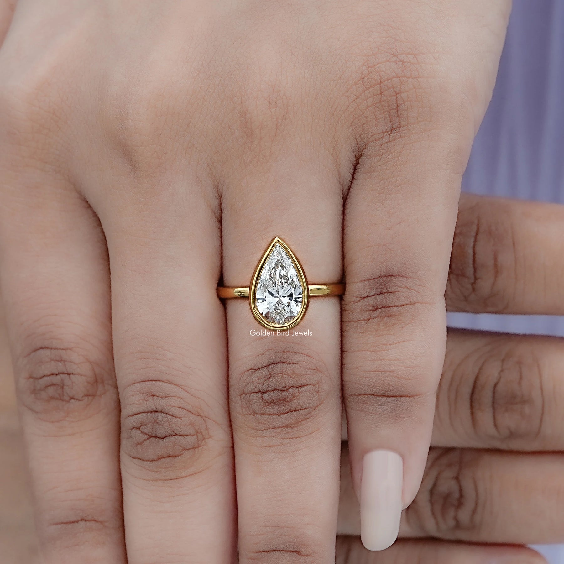 Top view of Bezel Set Pear Cut Diamond Solitaire Ring