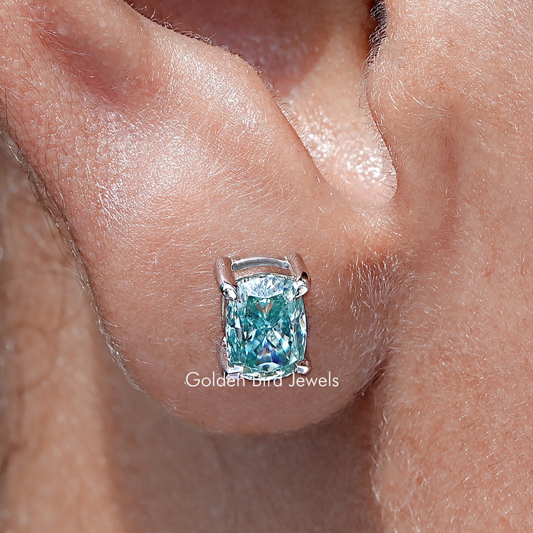 Front view of Solid Blue elongated cushion Cut moissanite Stud Earrings