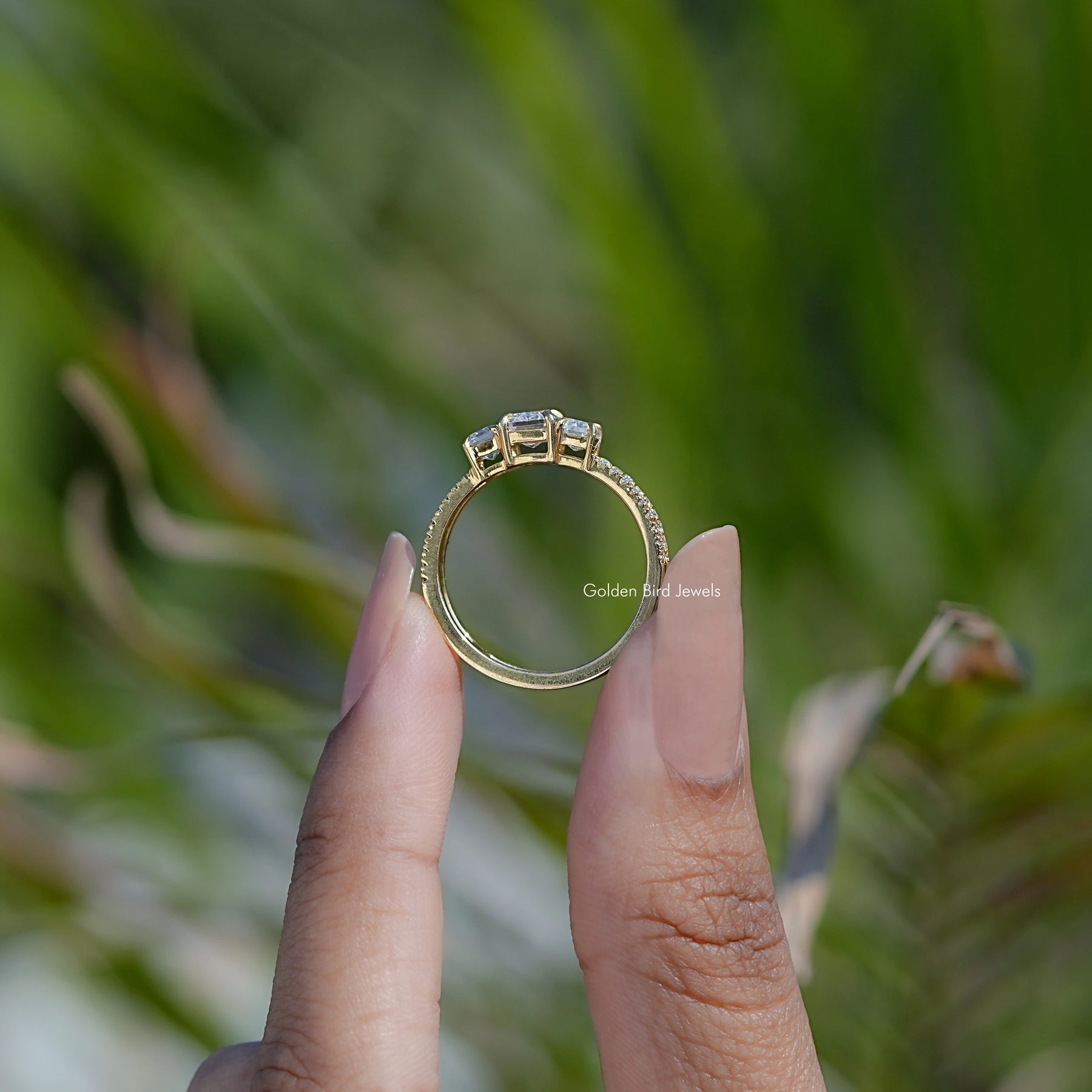 Back view of Emerald Cut Moissanite ring in secure setting