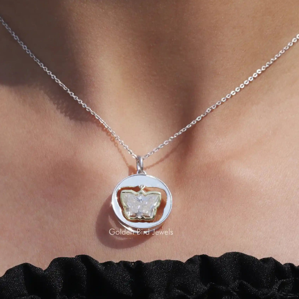 View of colorless butterfly cut moissanite pendant