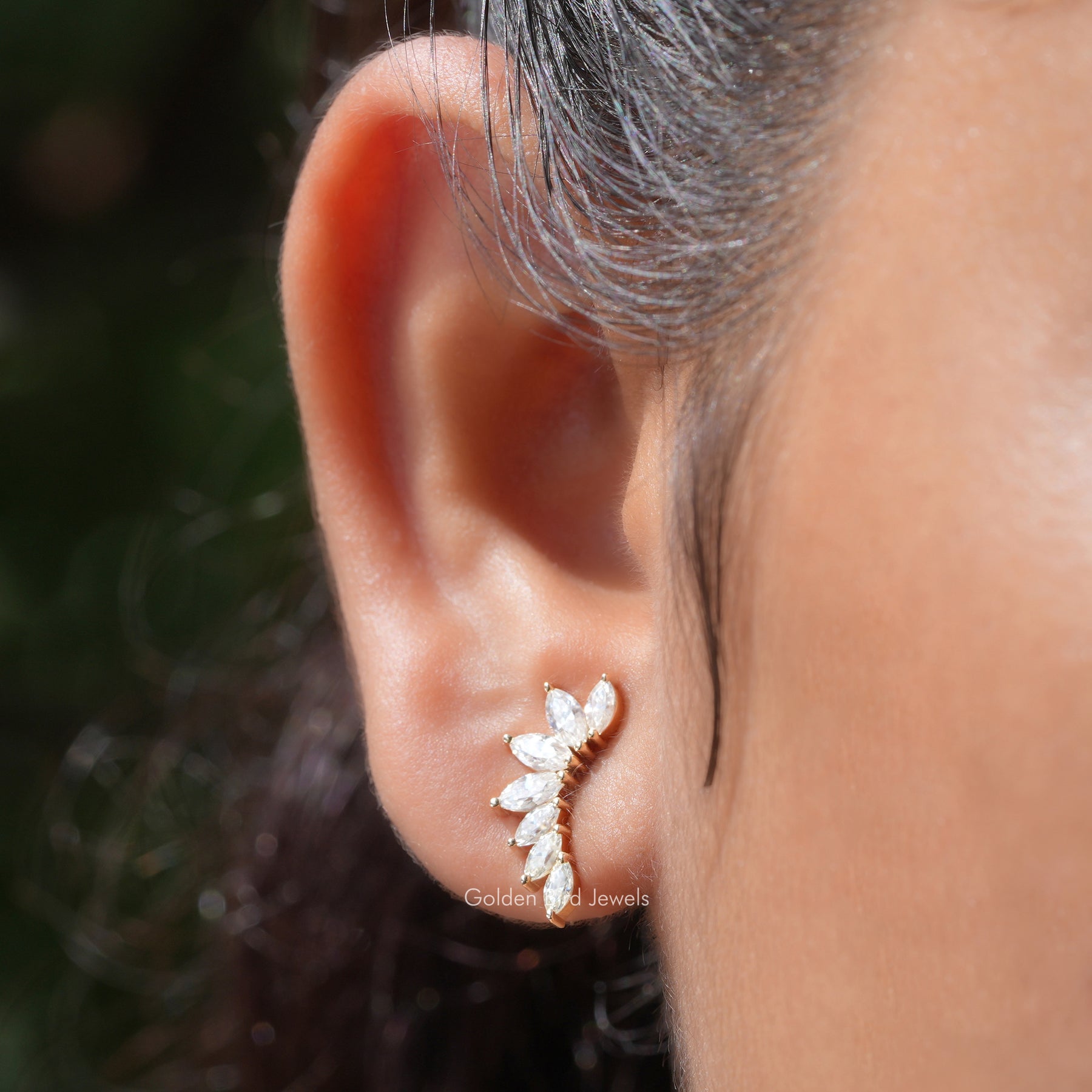 In ear front view of marquise cut stud earrings