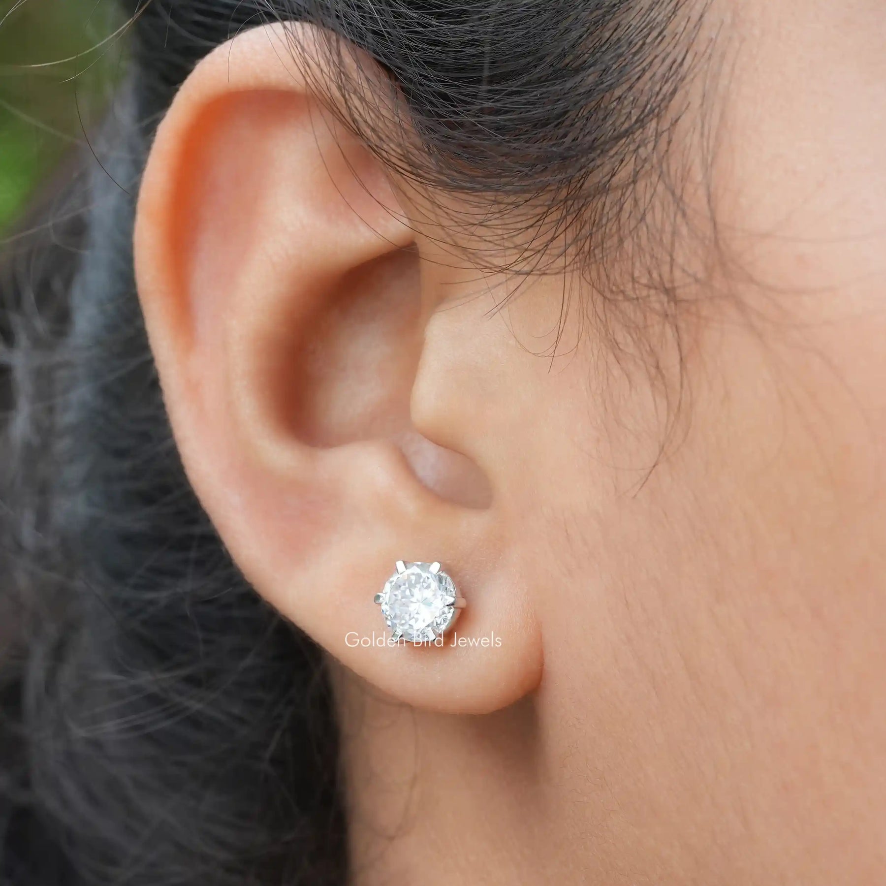A Close Up View of a Portuguese Cut Moissanite Wedding Earrings In Six-Prong Setting