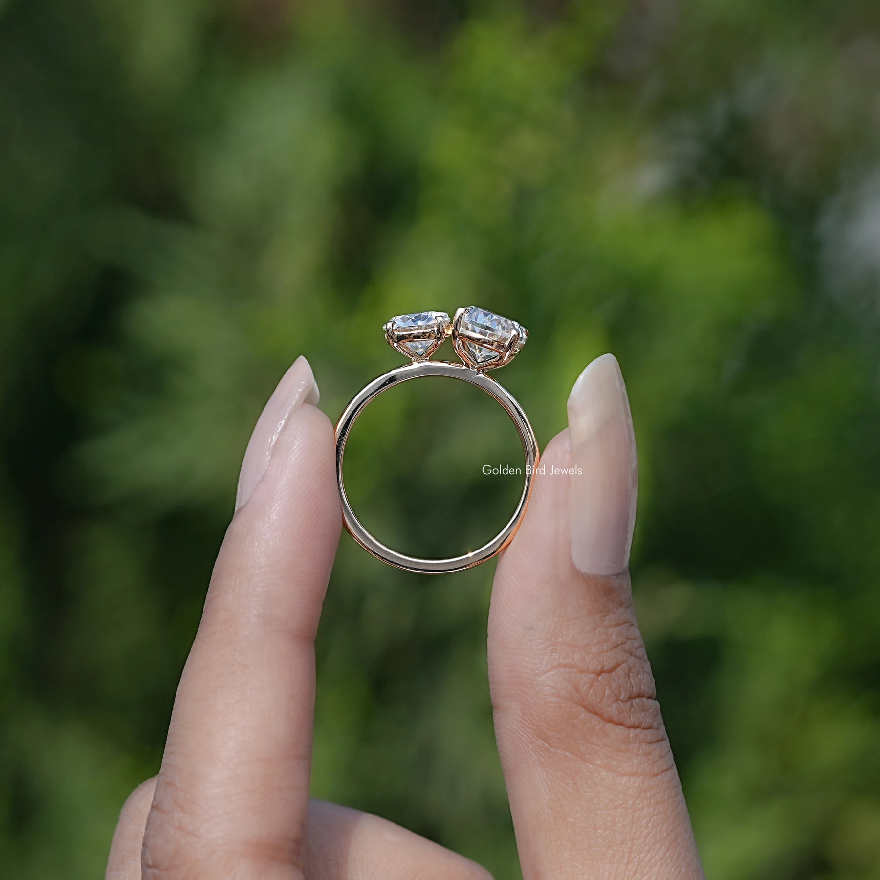 Back view of Crushed Ice Oval And Round Cut Moissanite Toi Et Moi Ring