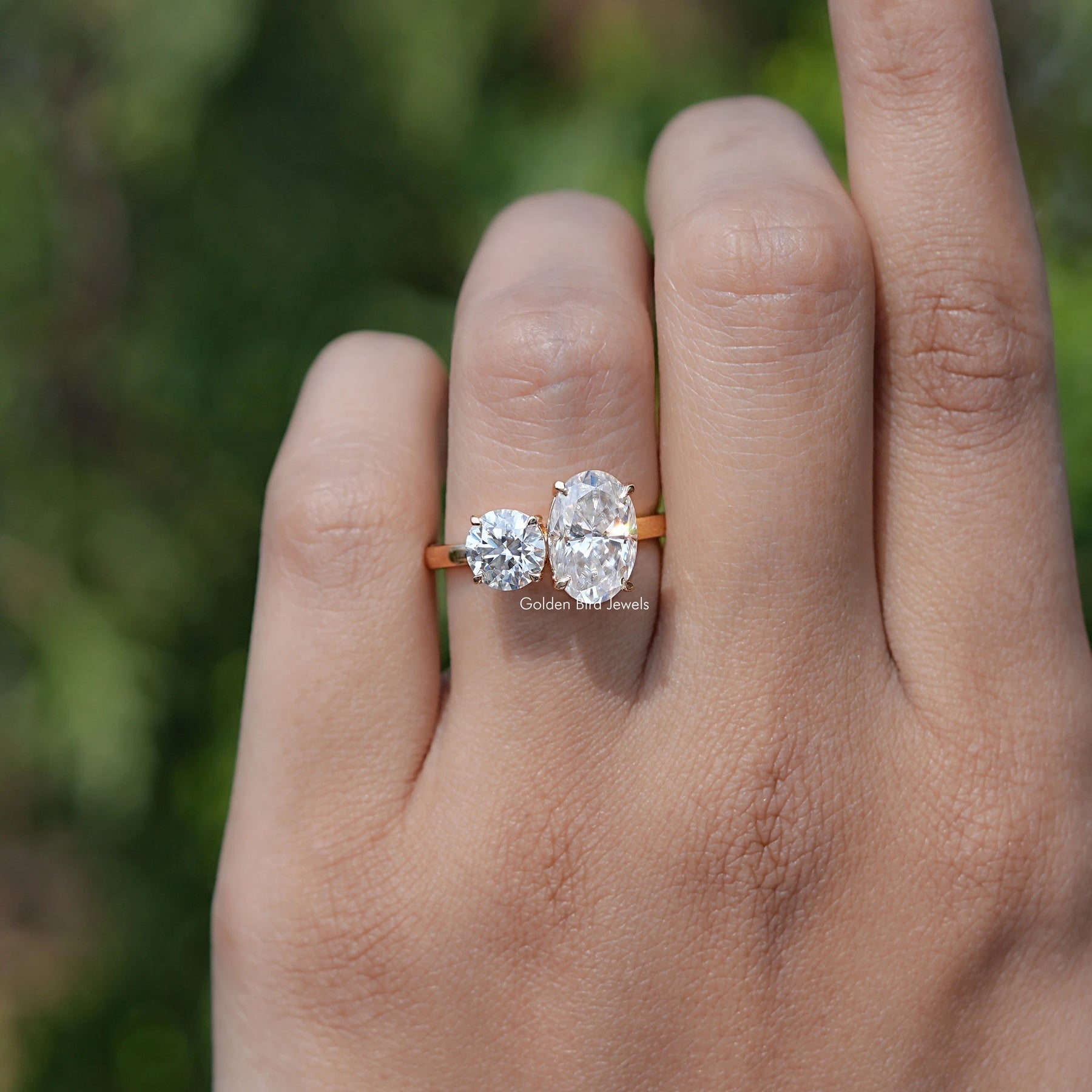In Finger view of Crushed Ice Oval And Round Cut Moissanite Toi Et Moi Ring