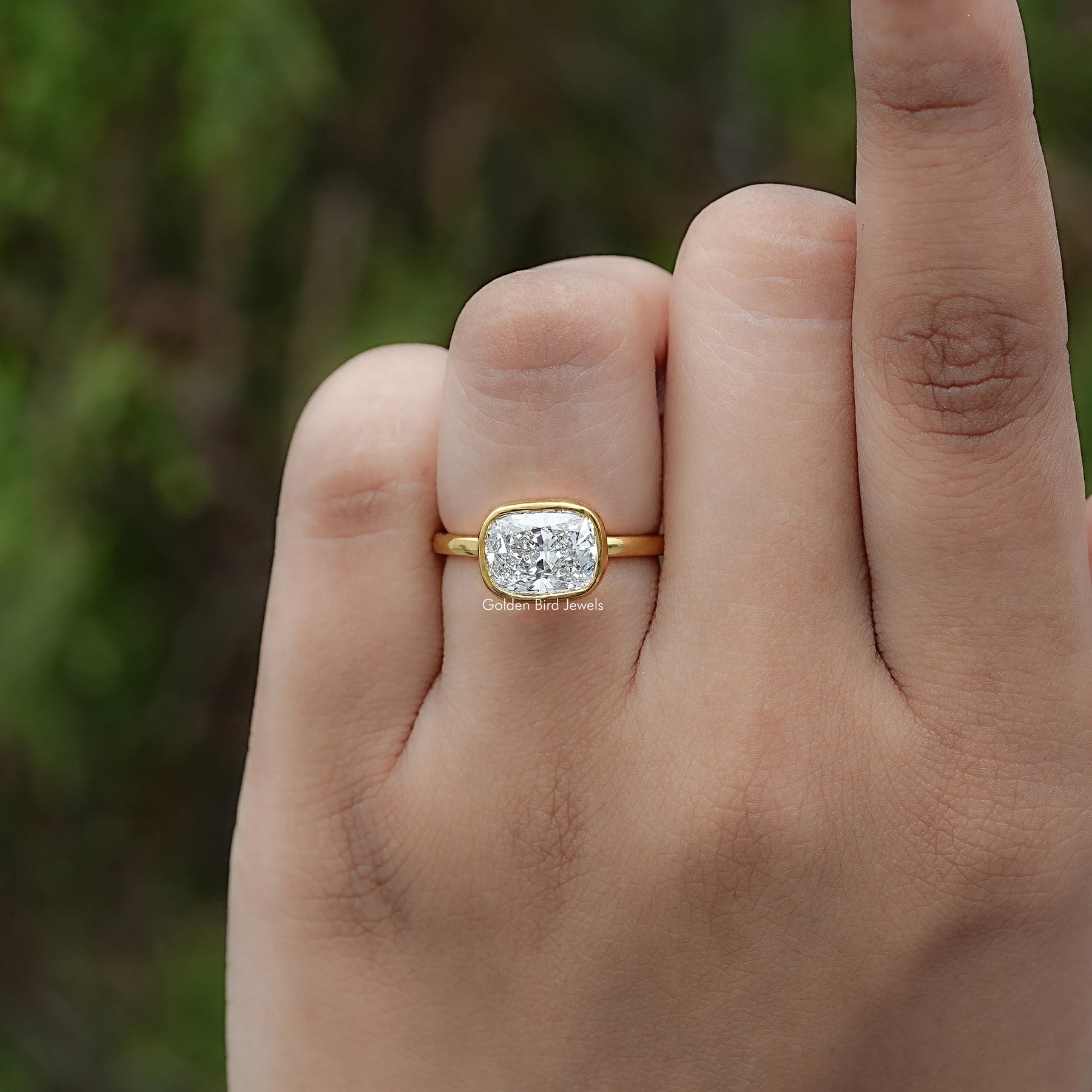 Front view of East West Cushion Diamond Bezel Set Ring
