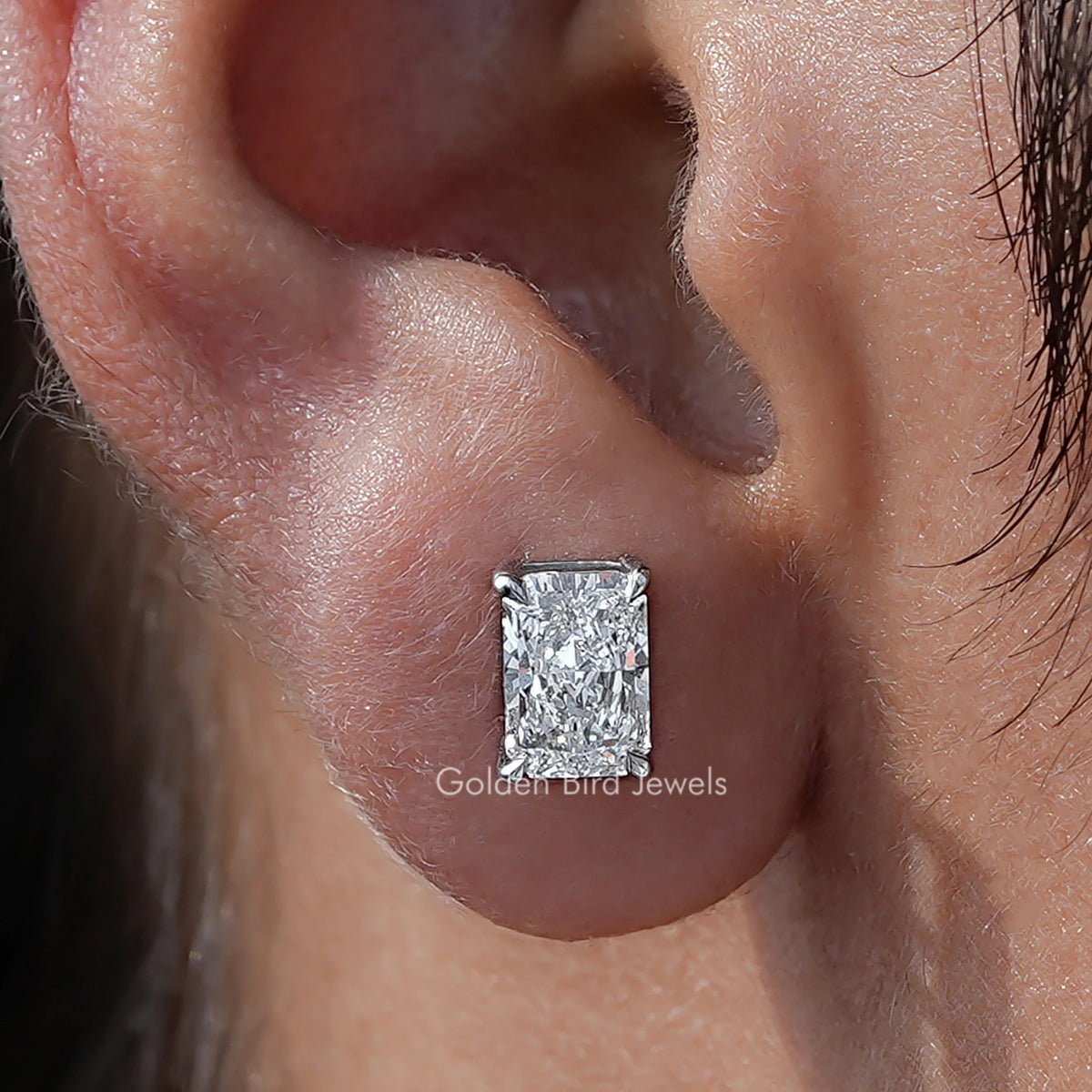 Close Up View Of Radiant Cut Diamond Solitaire Stud Earrings
