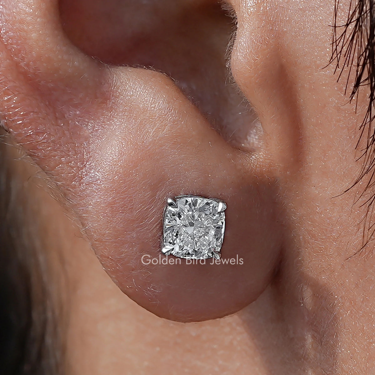 Close Up View Of Cushion Cut Diamond Solitaire Stud Earrings