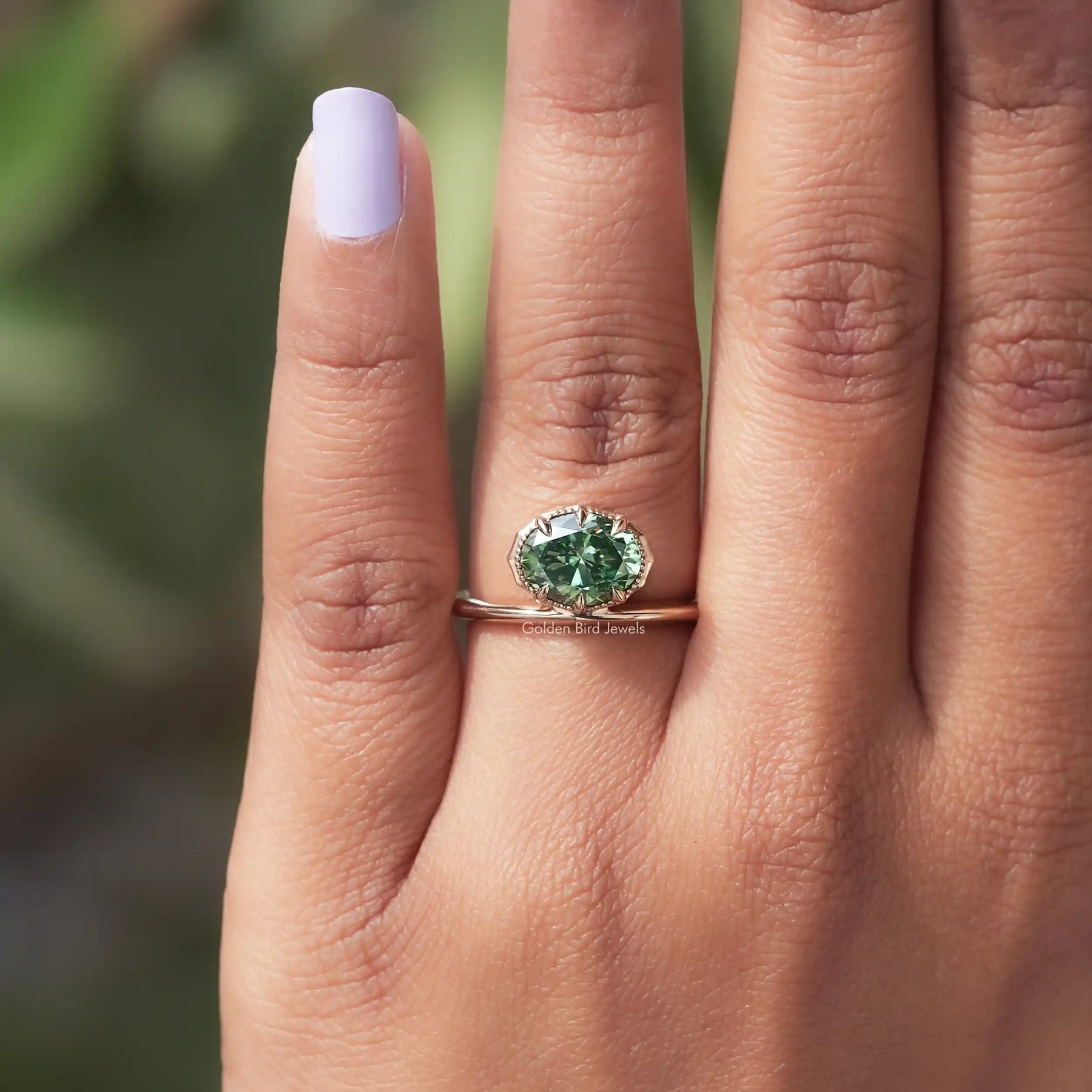 Detailed View Of East West Oval Cut Moissanite Solitaire Ring In Yellow Gold