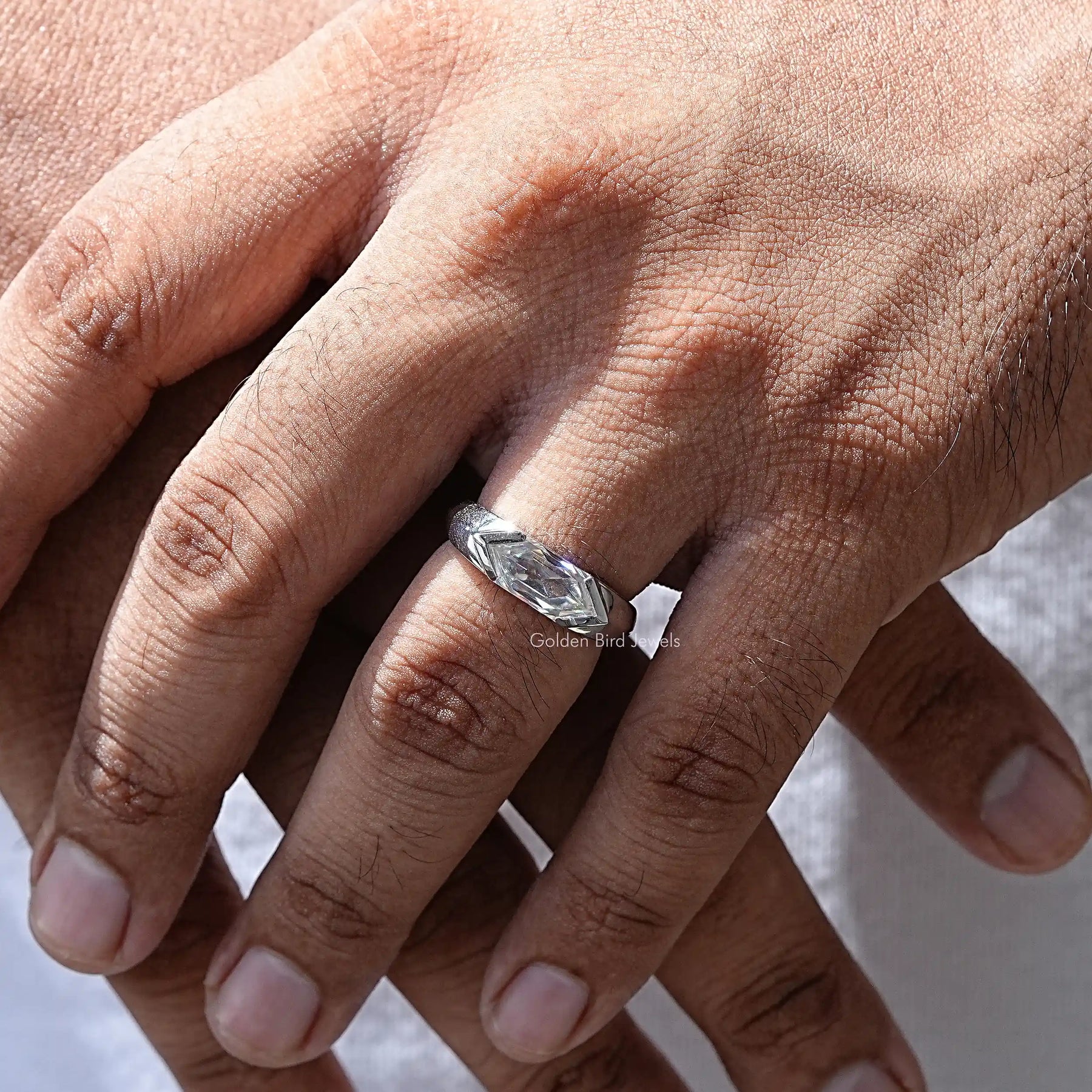 In hand showing a view of moissanite Ring