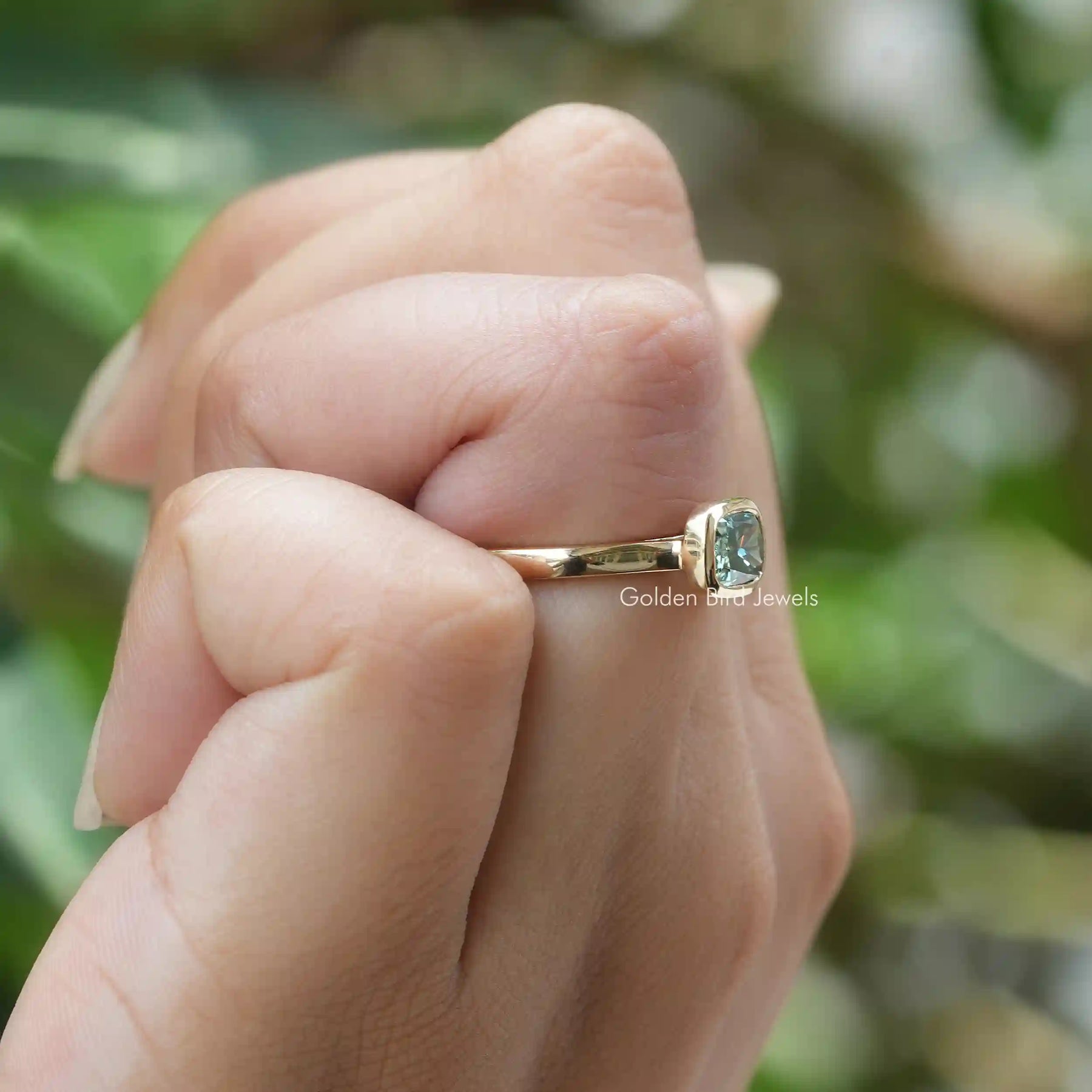 View of Cushion Cut Brilliant Moissanite Engagement Ring In Yellow Gold