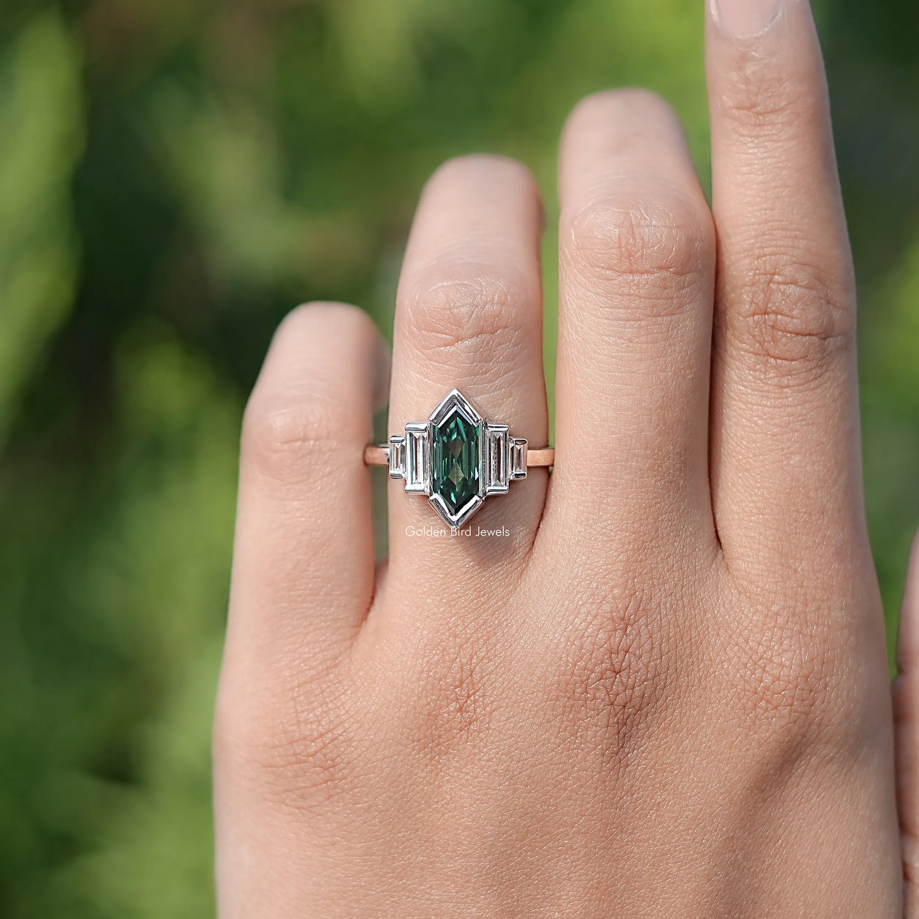 In finger view of Hexagon Cut Moissanite Five Stone Ring