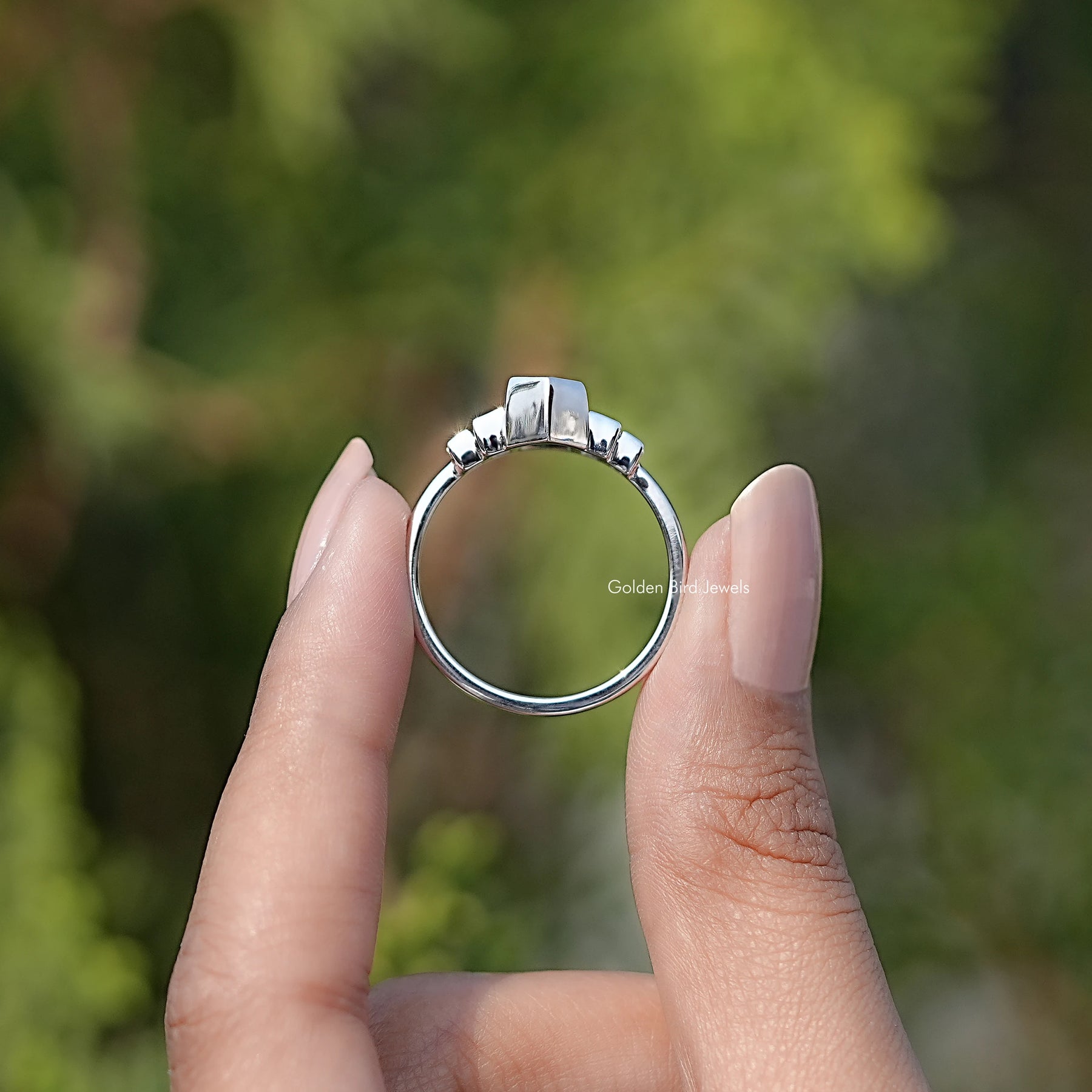 Back view of Elongated Hexagon Cut Moissanite Five Stone Ring in secure setting
