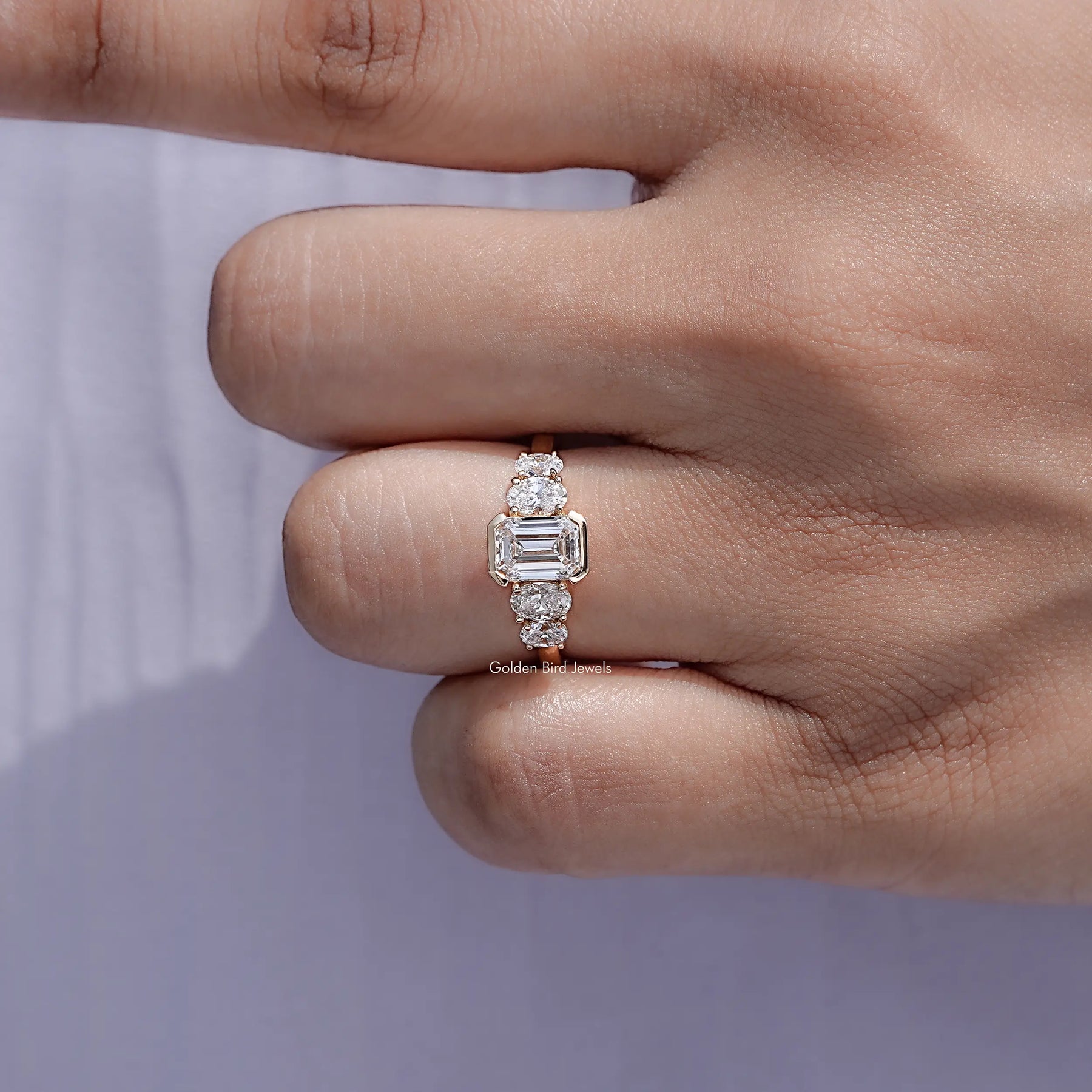 Detailed view of Pear And Baguette Cut Diamond Five Stone Ring