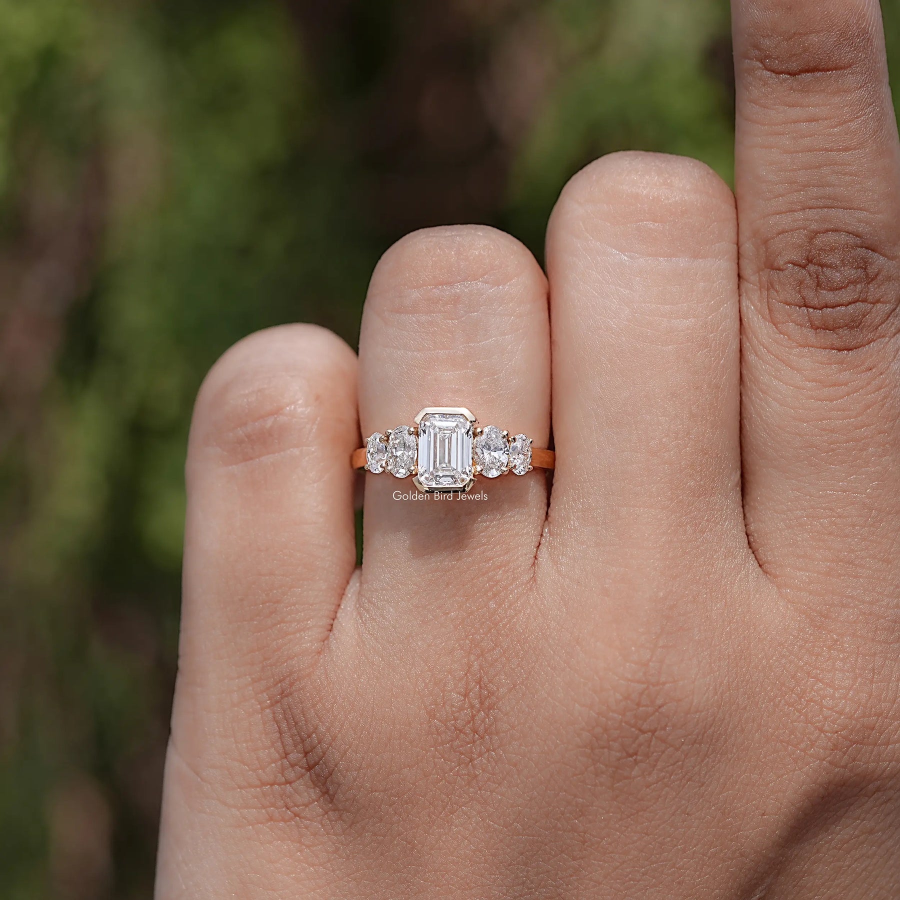 Front view of Pear And Baguette Cut Diamond Five Stone Ring