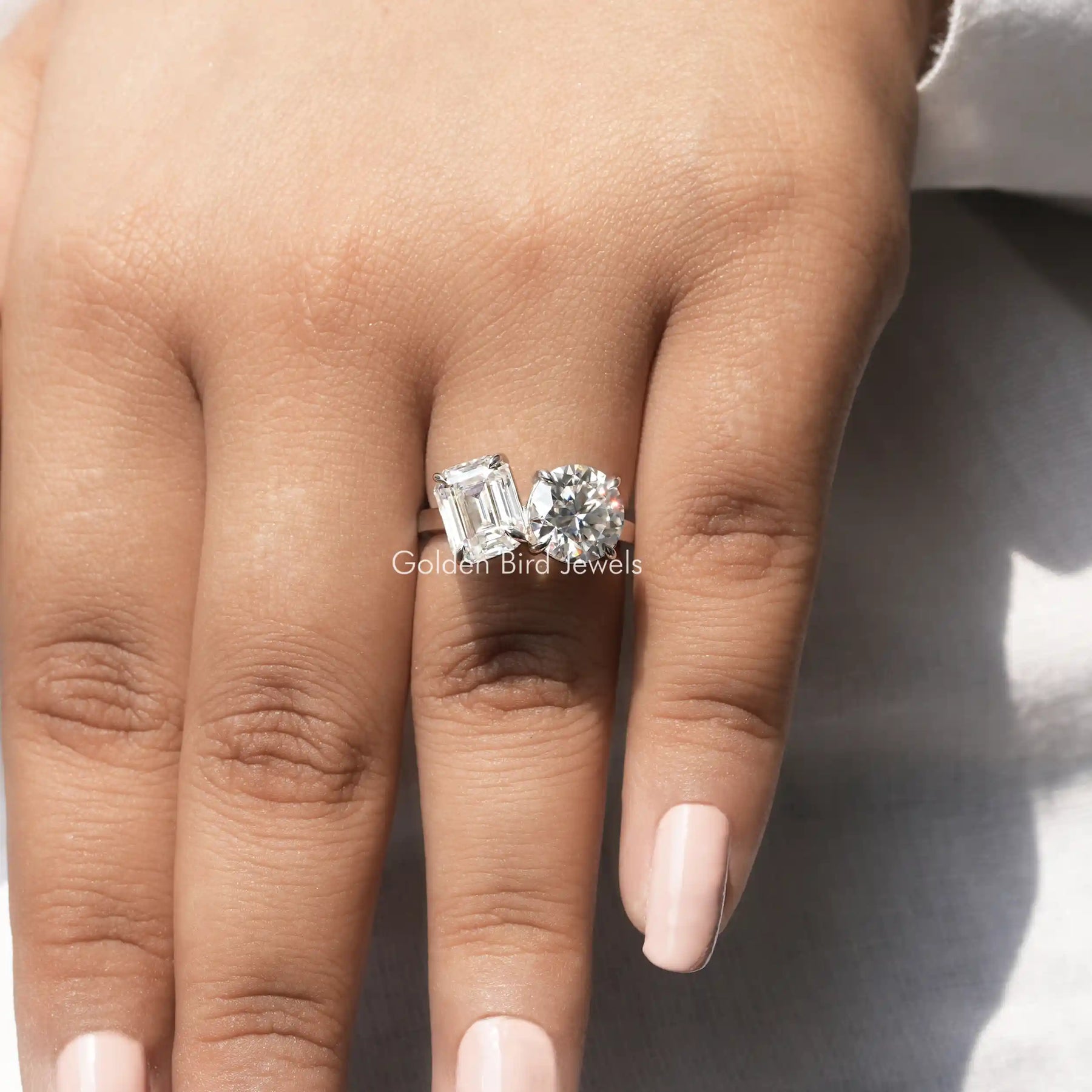 Close-Up View of Emerald And Round Cut Moissanite Ring In White Gold