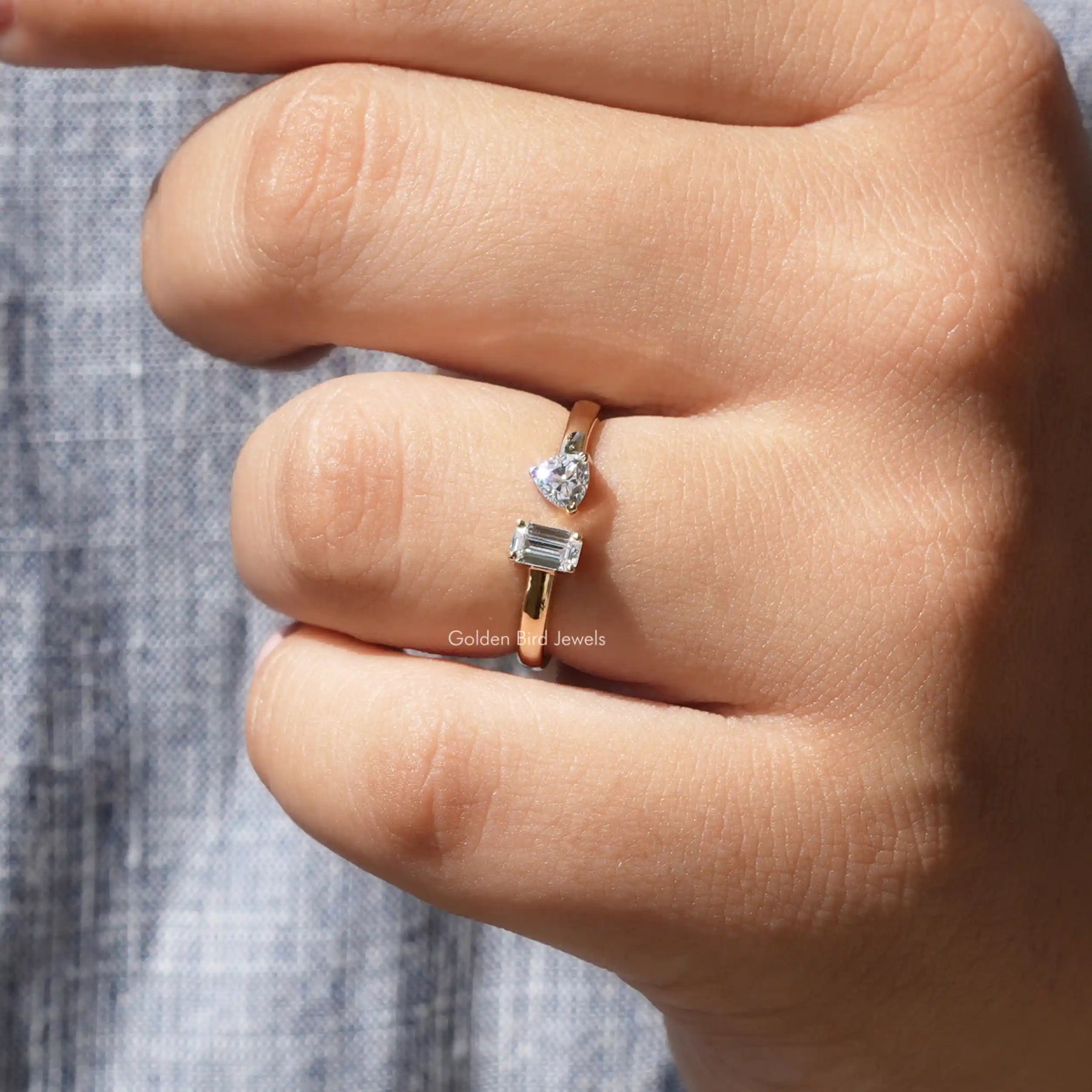 Close-Up View of Emerald Cut Moissanite Toi Et Moi Ring In Yellow Gold