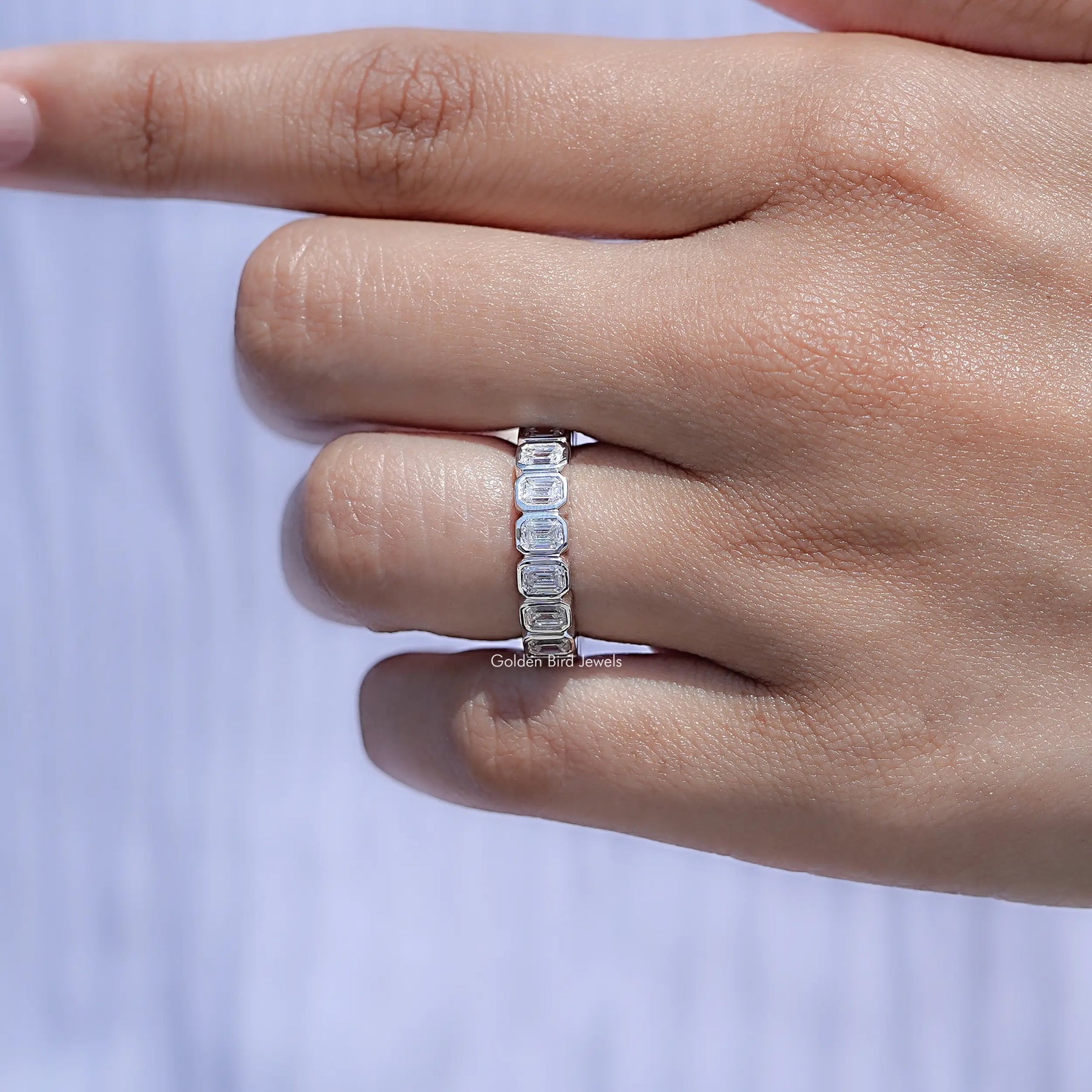 Close view of Bezel Set Emerald Cut Full Eternity Band