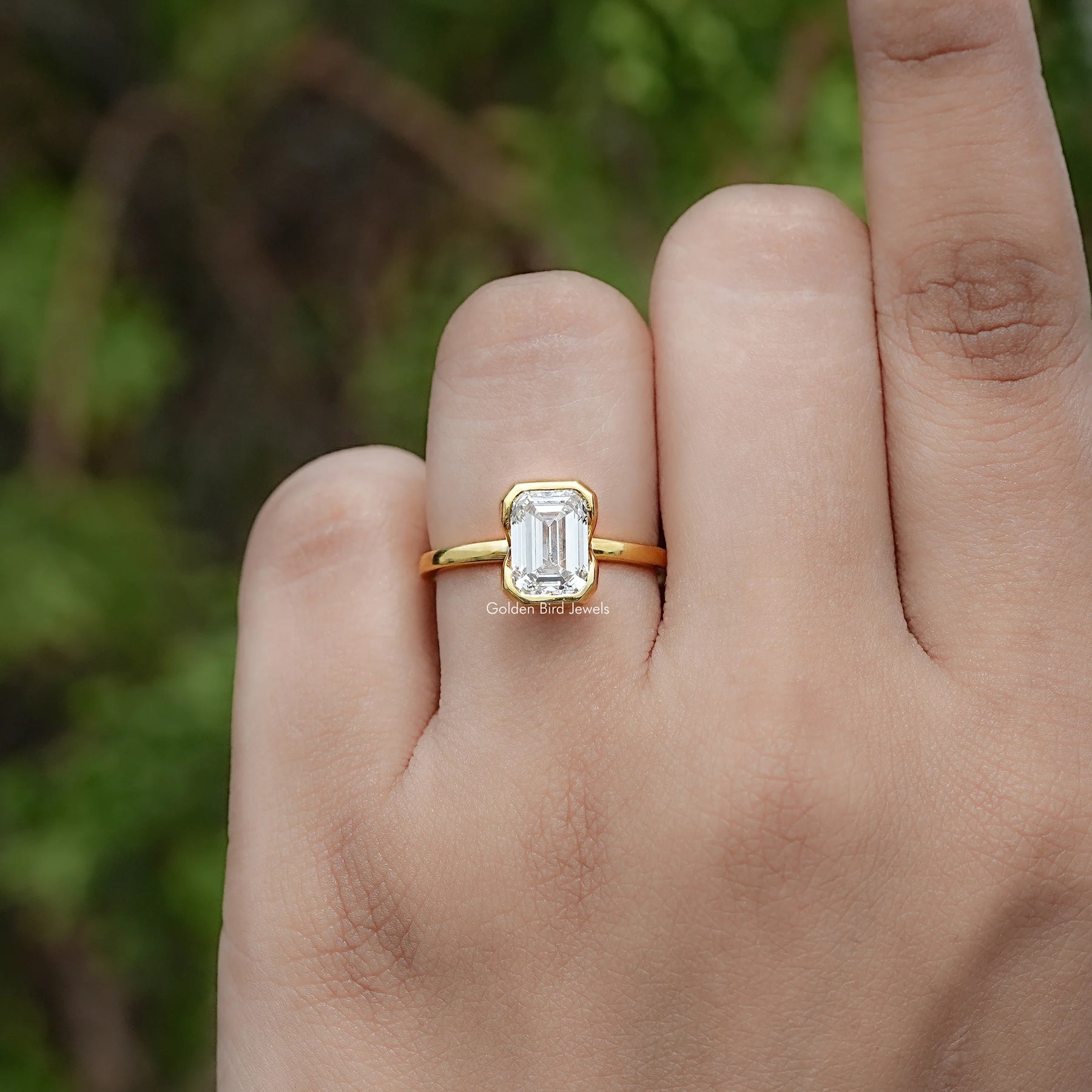 Front view of Emerald Cut Lab Diamond Bezel Set Solitaire Ring