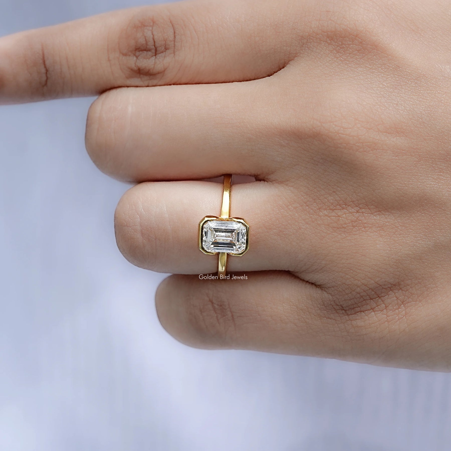 Detailed view of Emerald Diamond Bezel Set Solitaire Ring