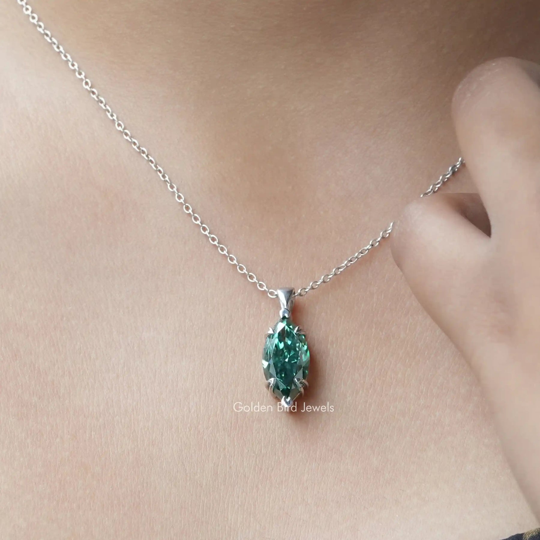 In neck view of marquise cut moissanite halo pendant