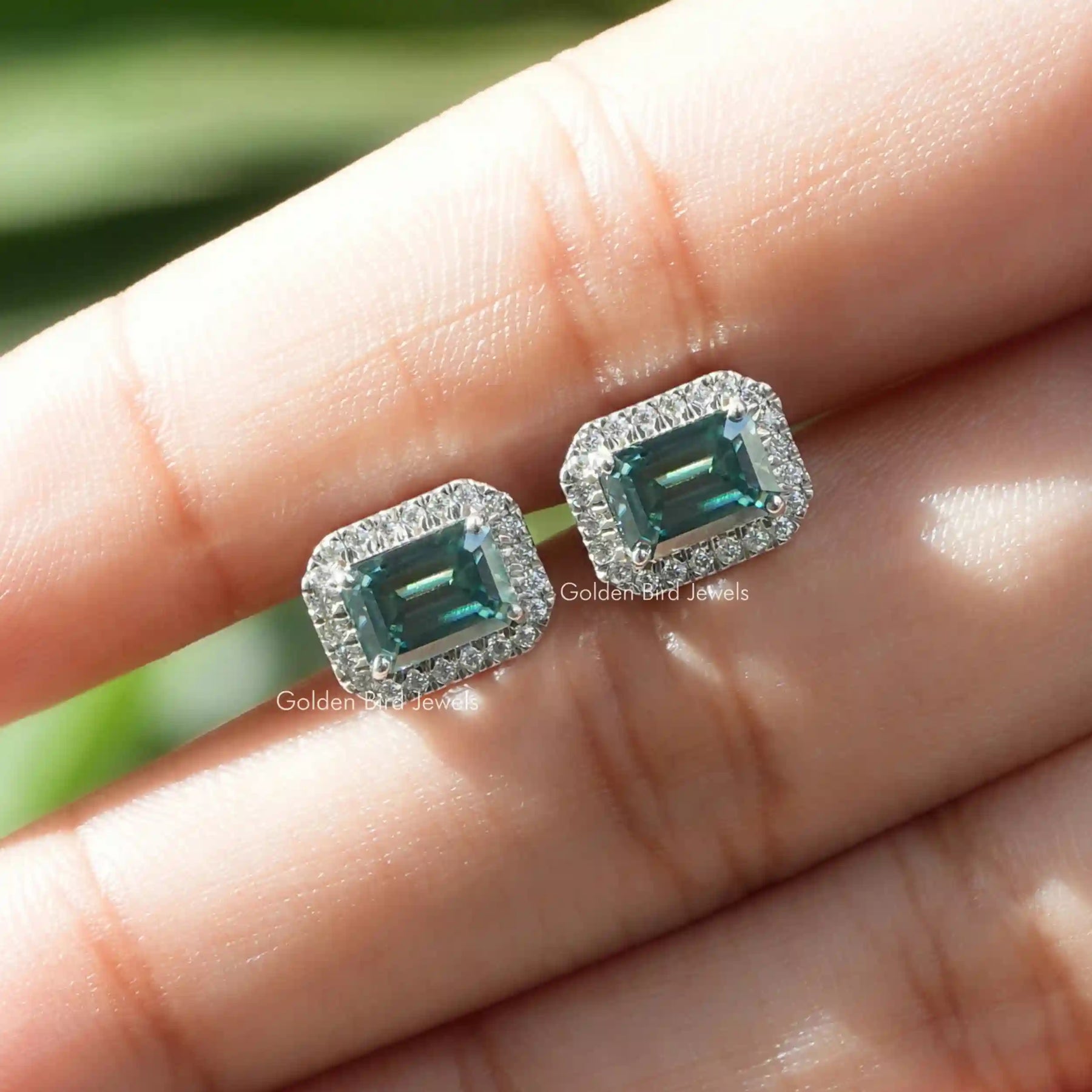 Green emerald cut stud earrings in vvs clarity