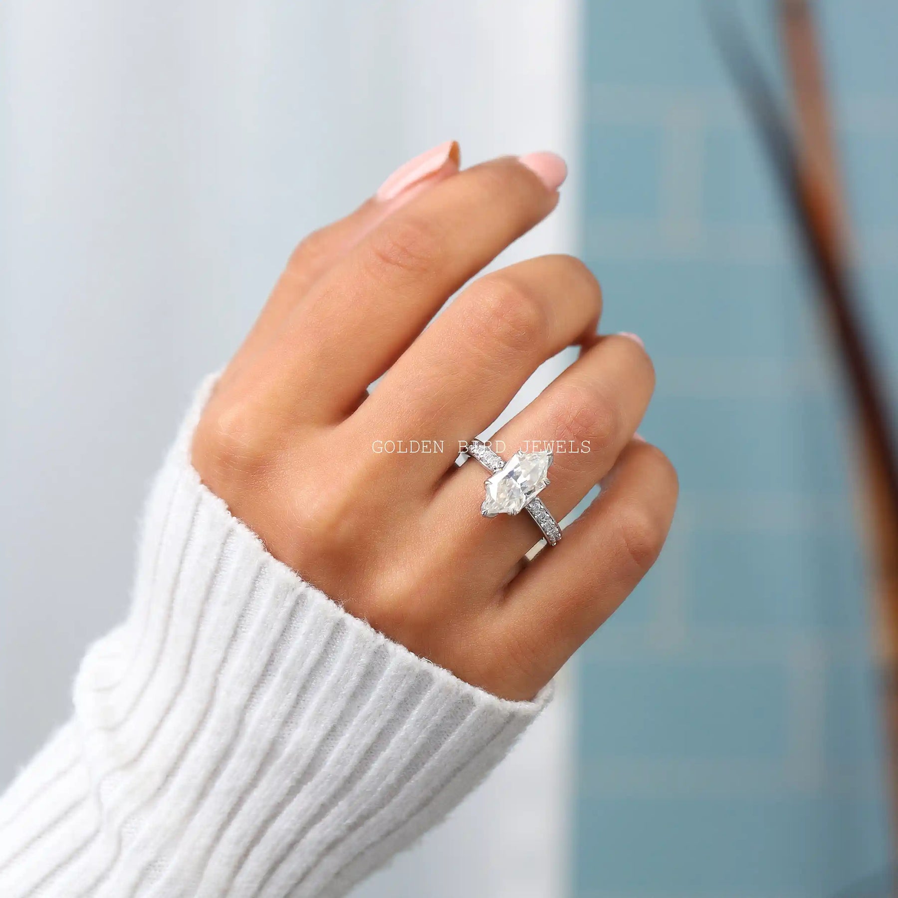 In finger front view of the marquise cut half eternity ring