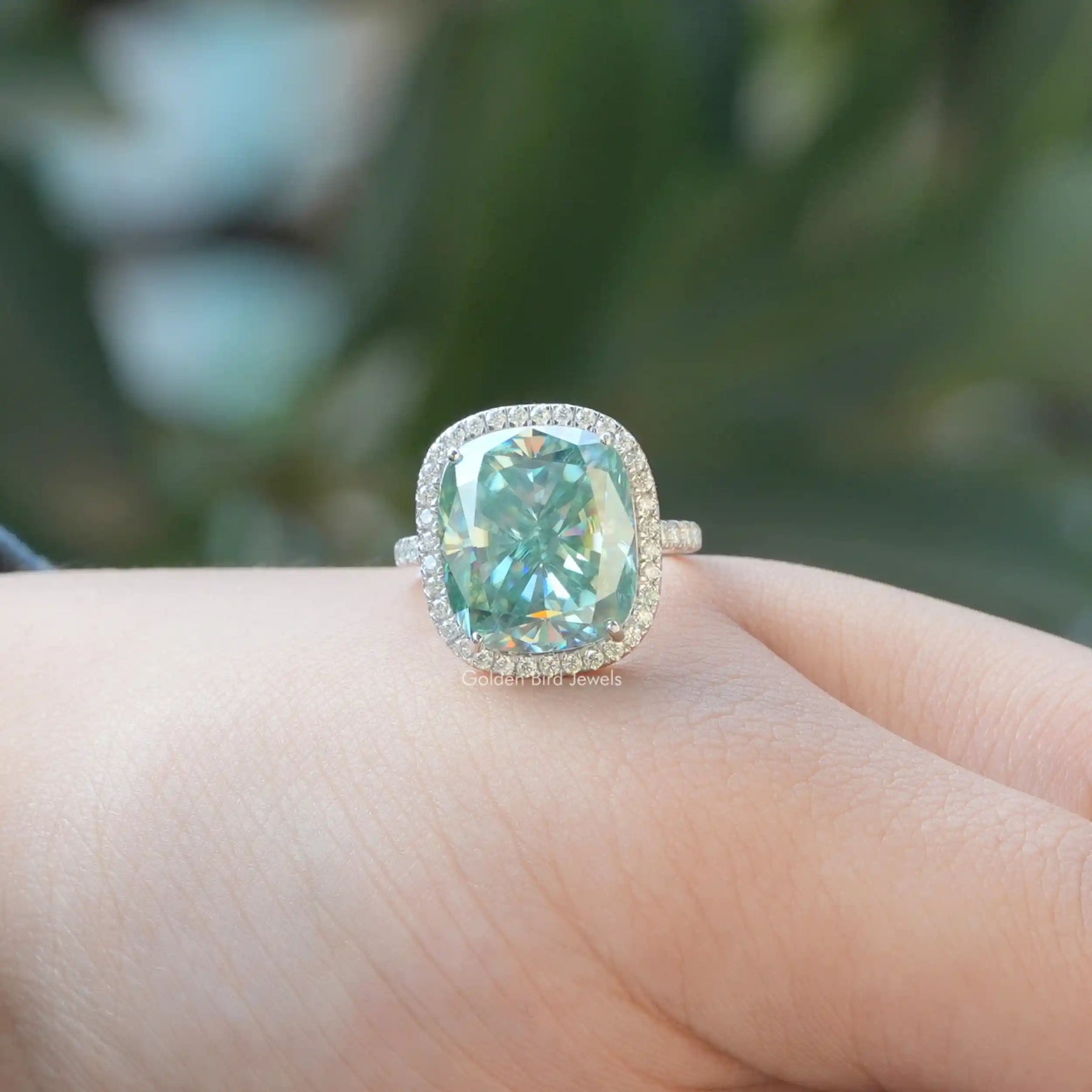 View of Moissanite Cushion and Round Cut Halo Ring In White Gold