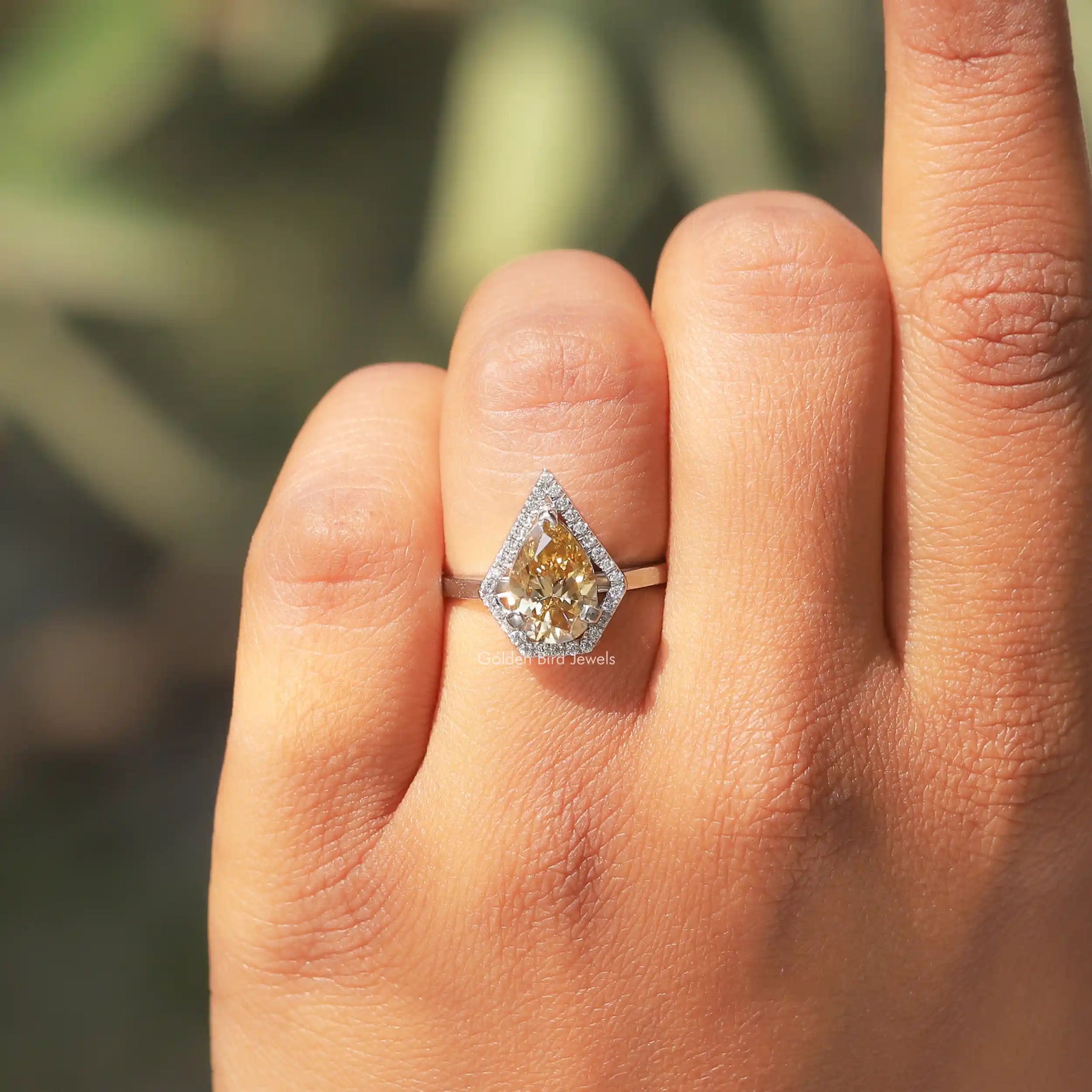 Detailed View Of Pear And Round Cut Moissanite Ring In White Gold