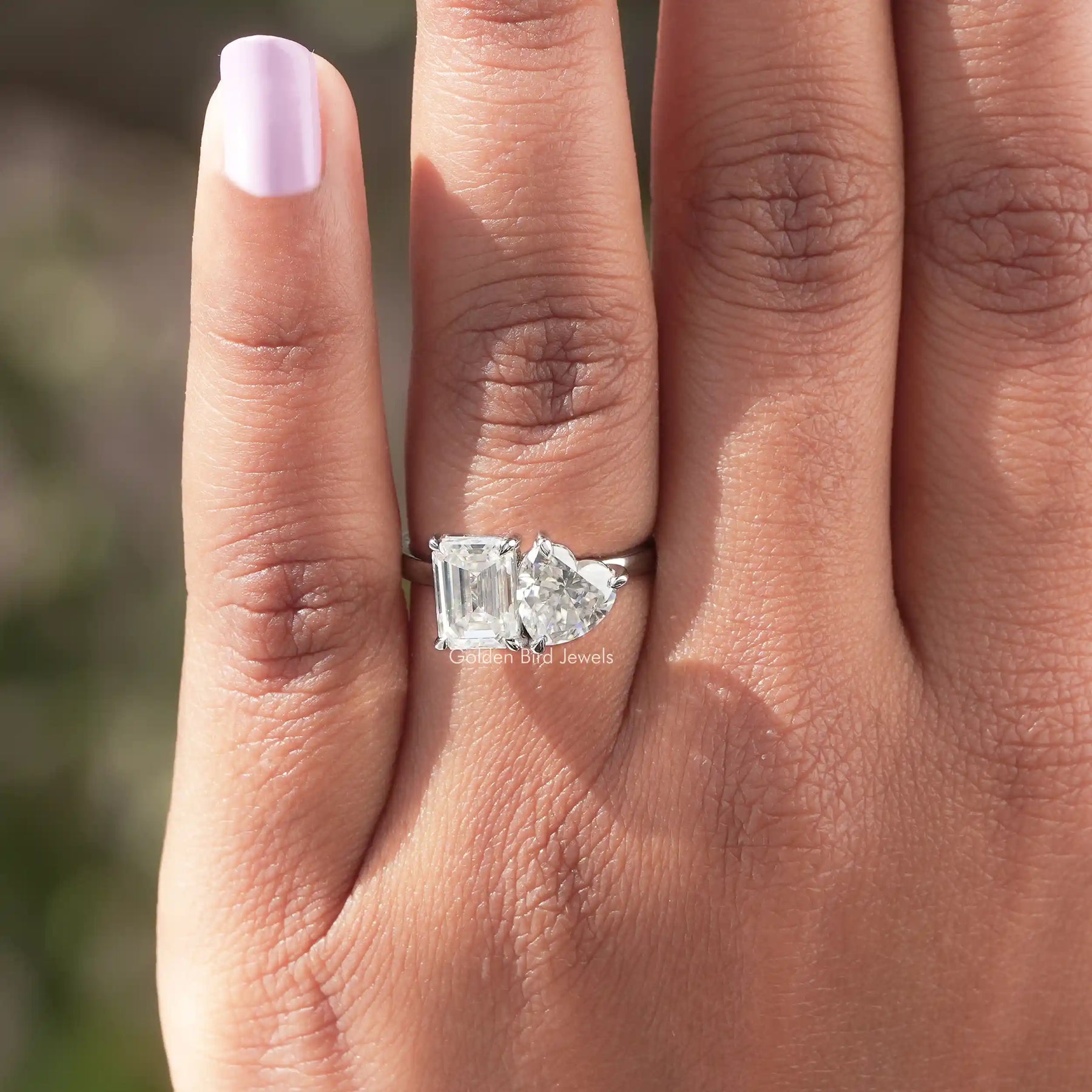 Heart and emrald shaped toi-et-moi ring crafted  in moissanite