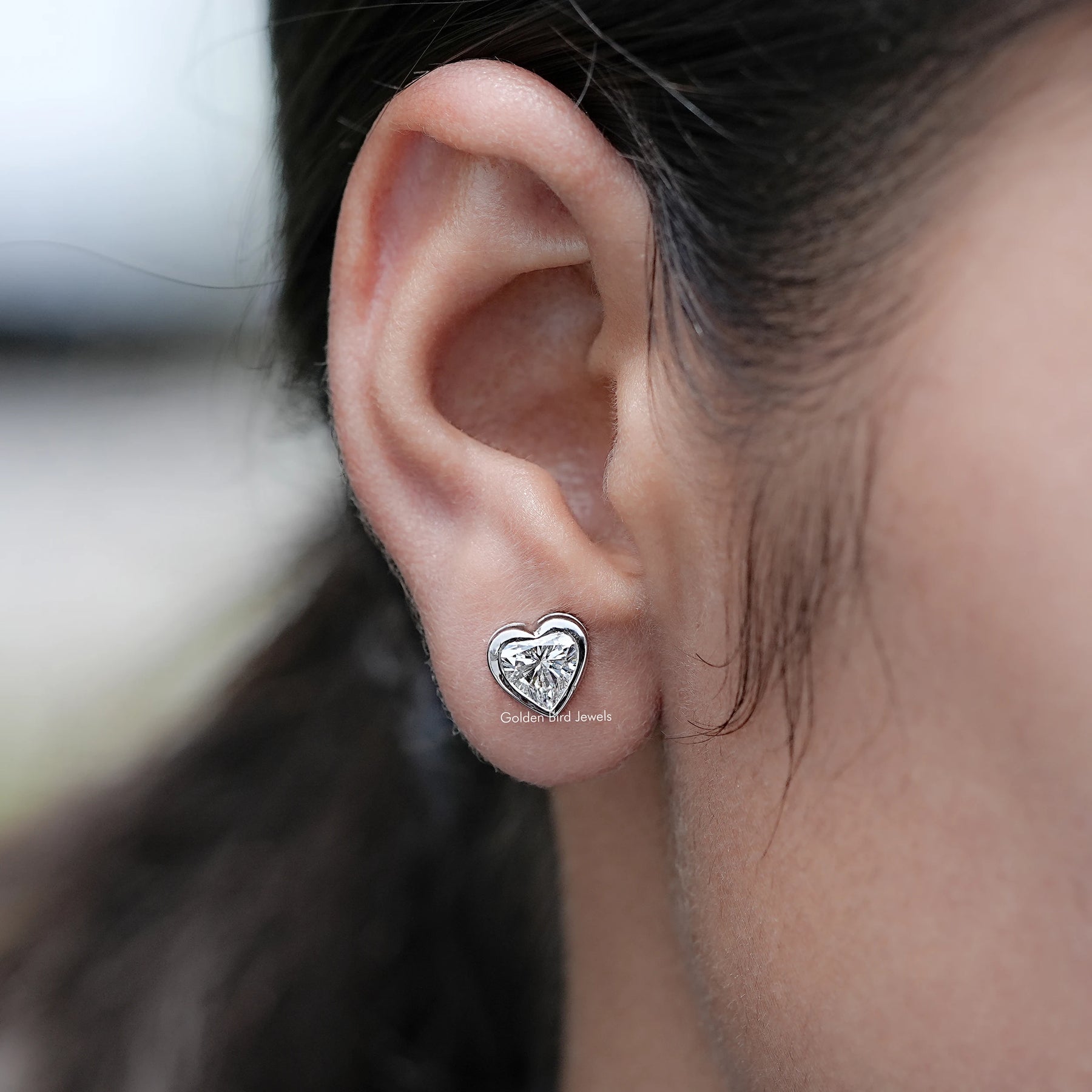 In Ear View of Heart Shaped Lab Grown Diamond Stud Earrings