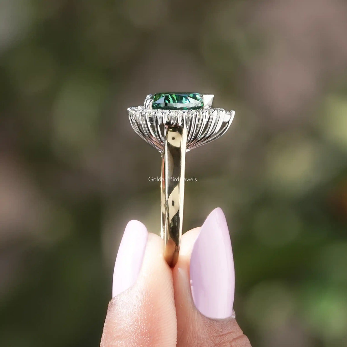 Side View of Heart And Round Cut Moissanite Halo Ring In two fingers