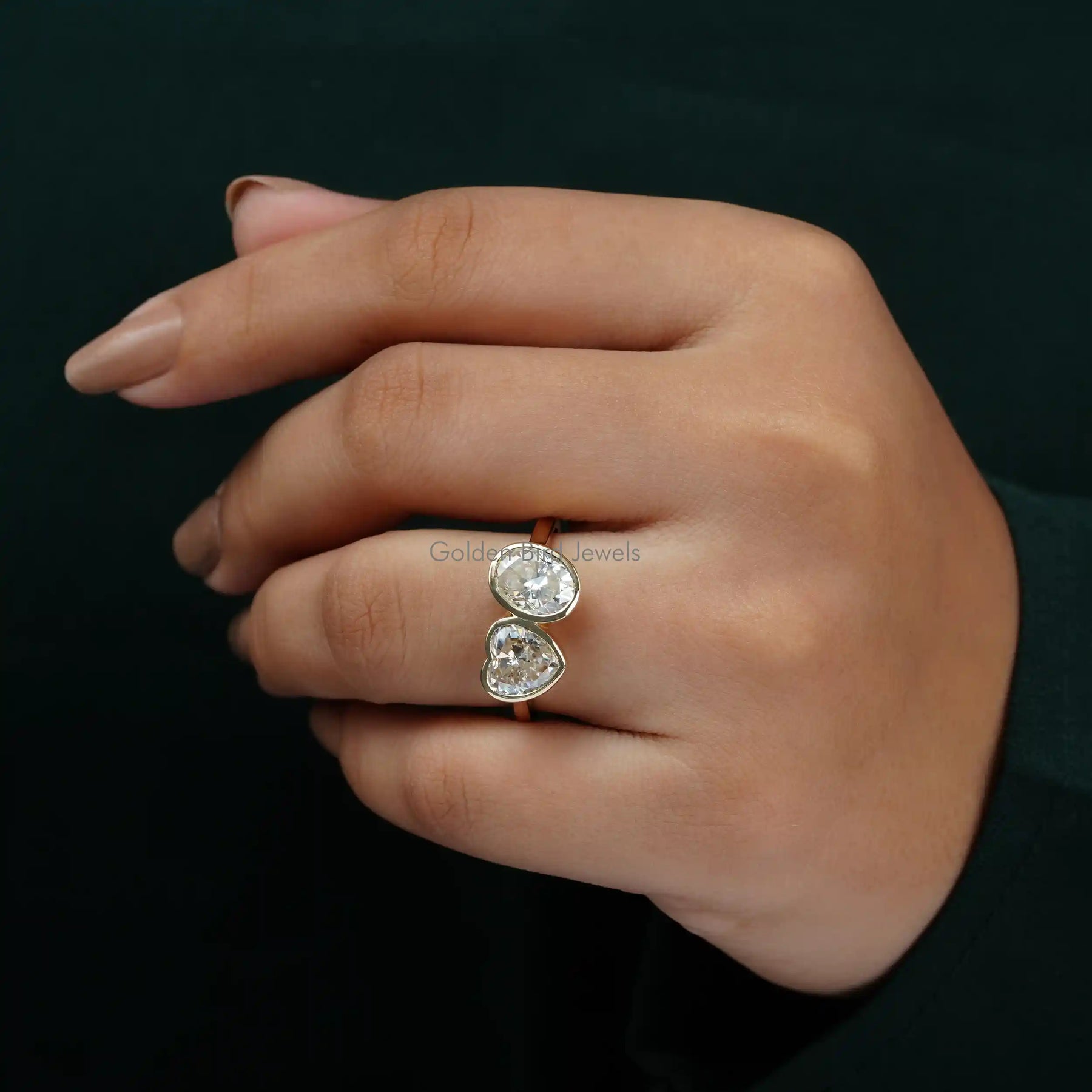 View of Oval And Heart Cut 2 Stone Moissanite Wedding Ring In Finger