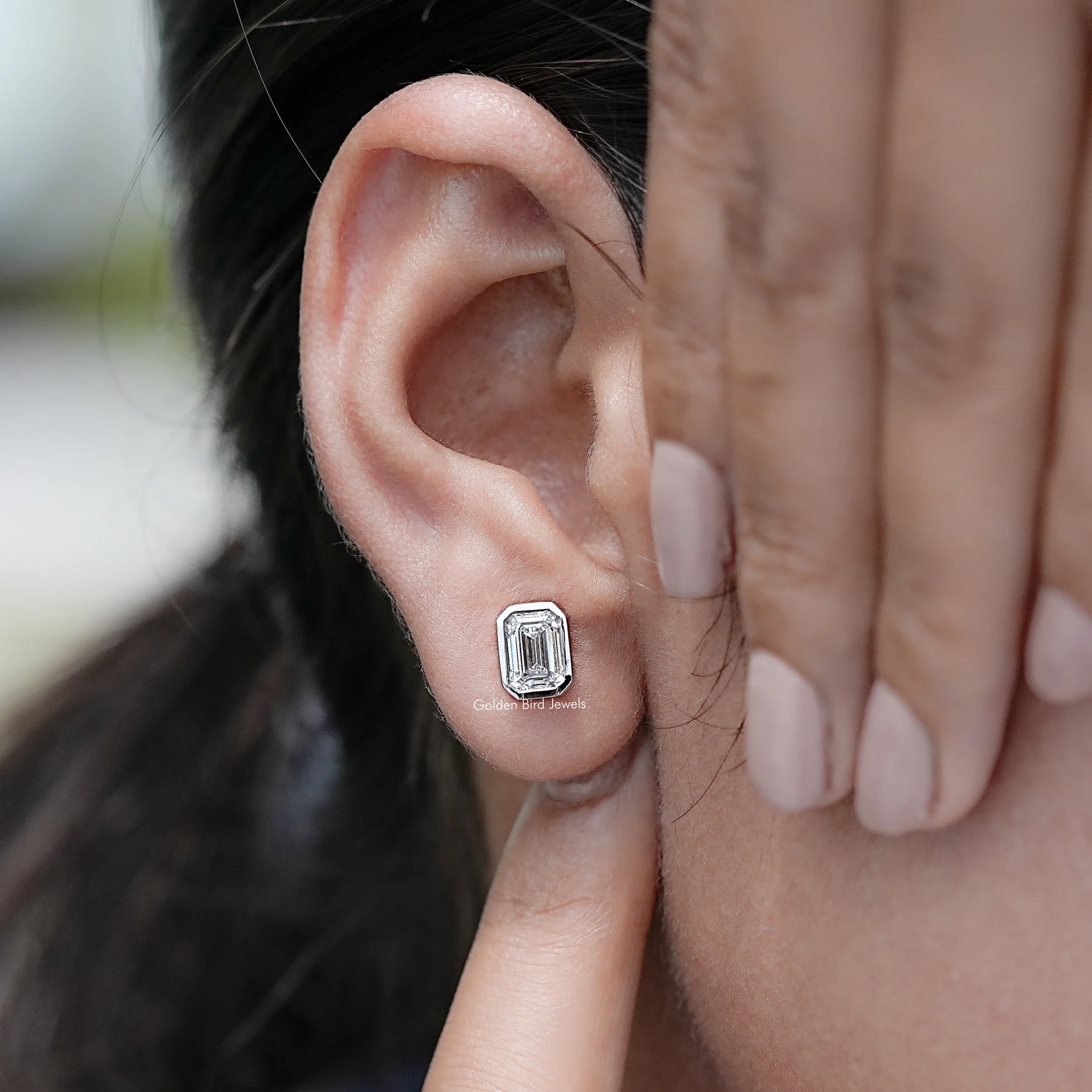 Display view of Emerald Cut Lab Diamond Bezel Set Stud Earrings