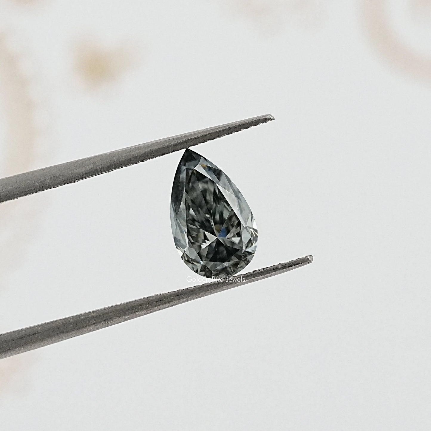 tweezers View of Pear Cut Loose moissanite