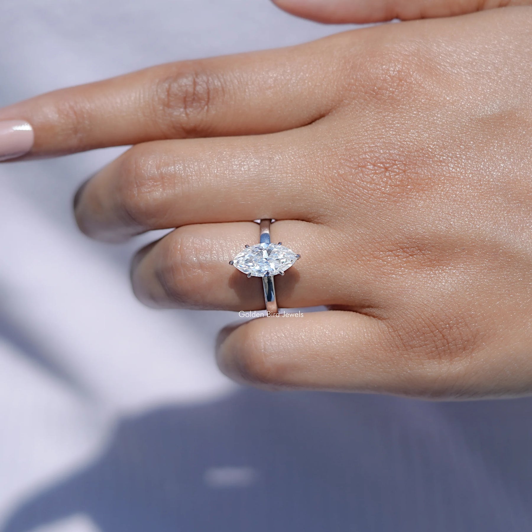 View of solitaire Marquise Cut Moissanite ring in prongs setting