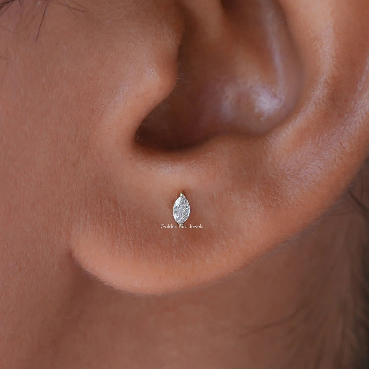 In Ear View Of Marquise Cut Diamond Cut Stud Earrings