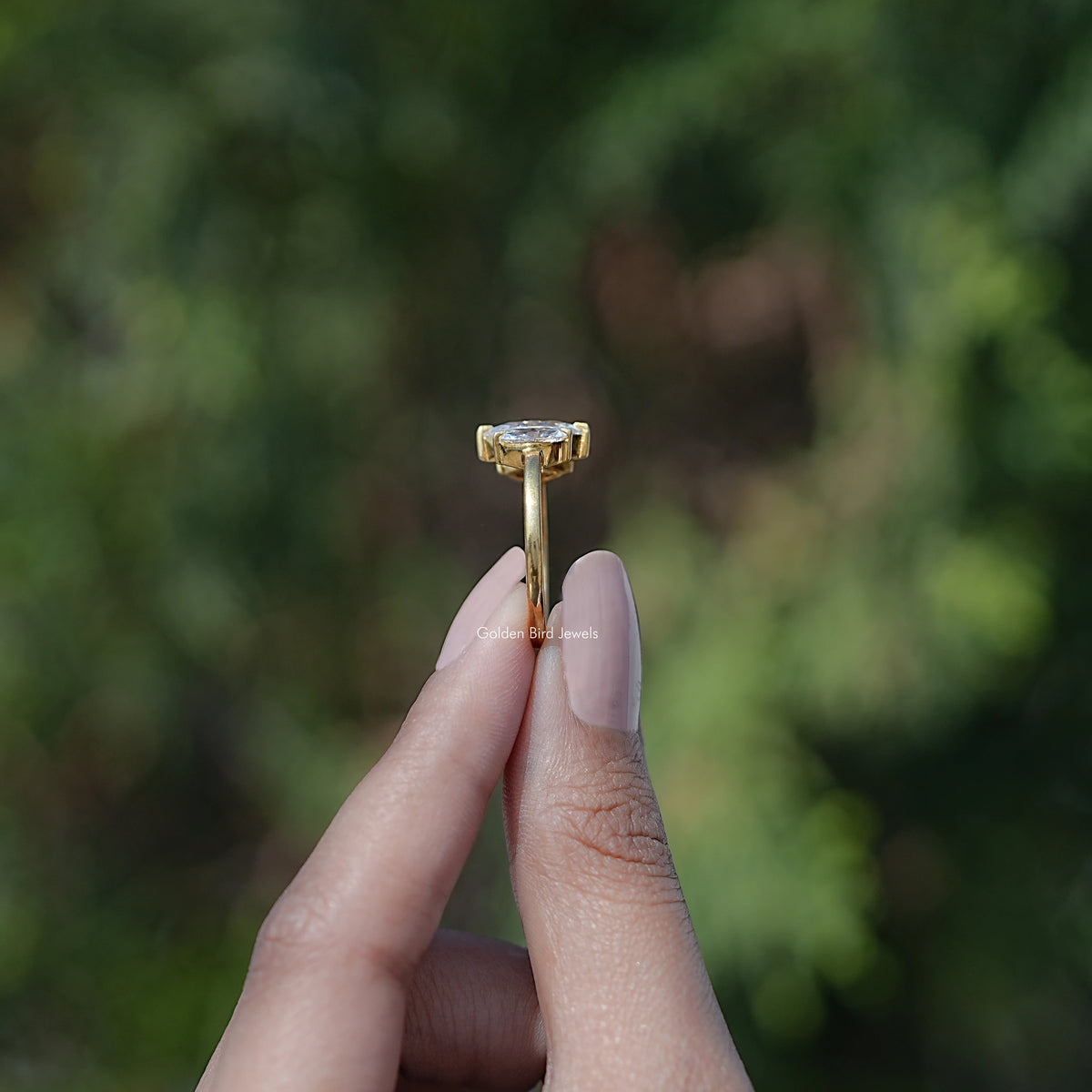 Side View of Marquise Moissanite Three Stone Engagement Ring