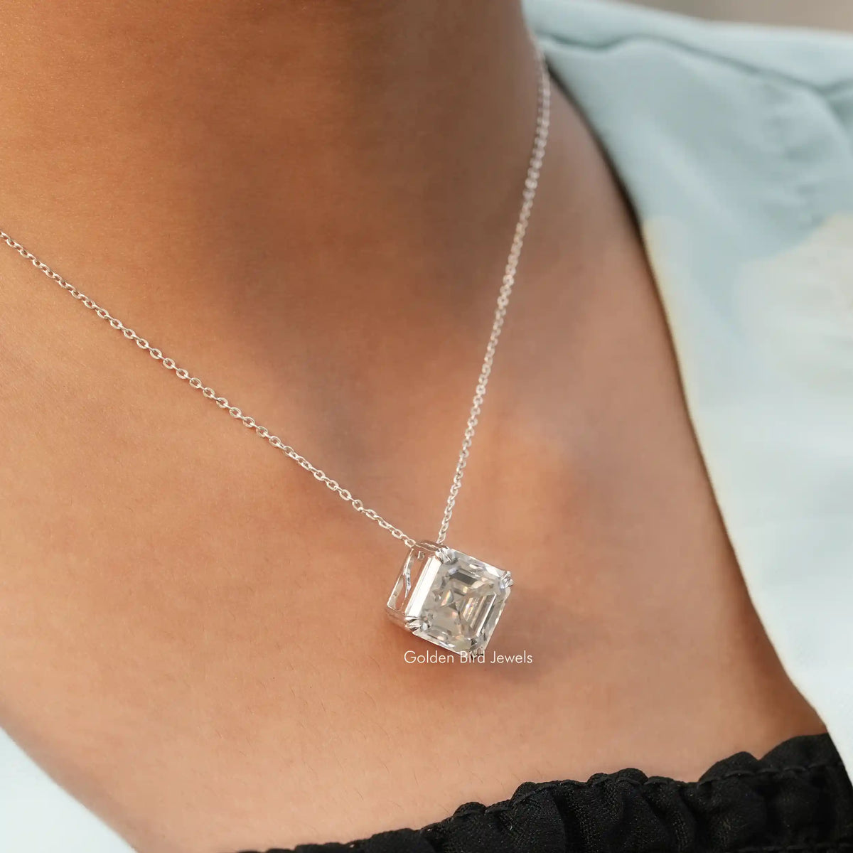 In neck view of cluster moissanite halo pendant