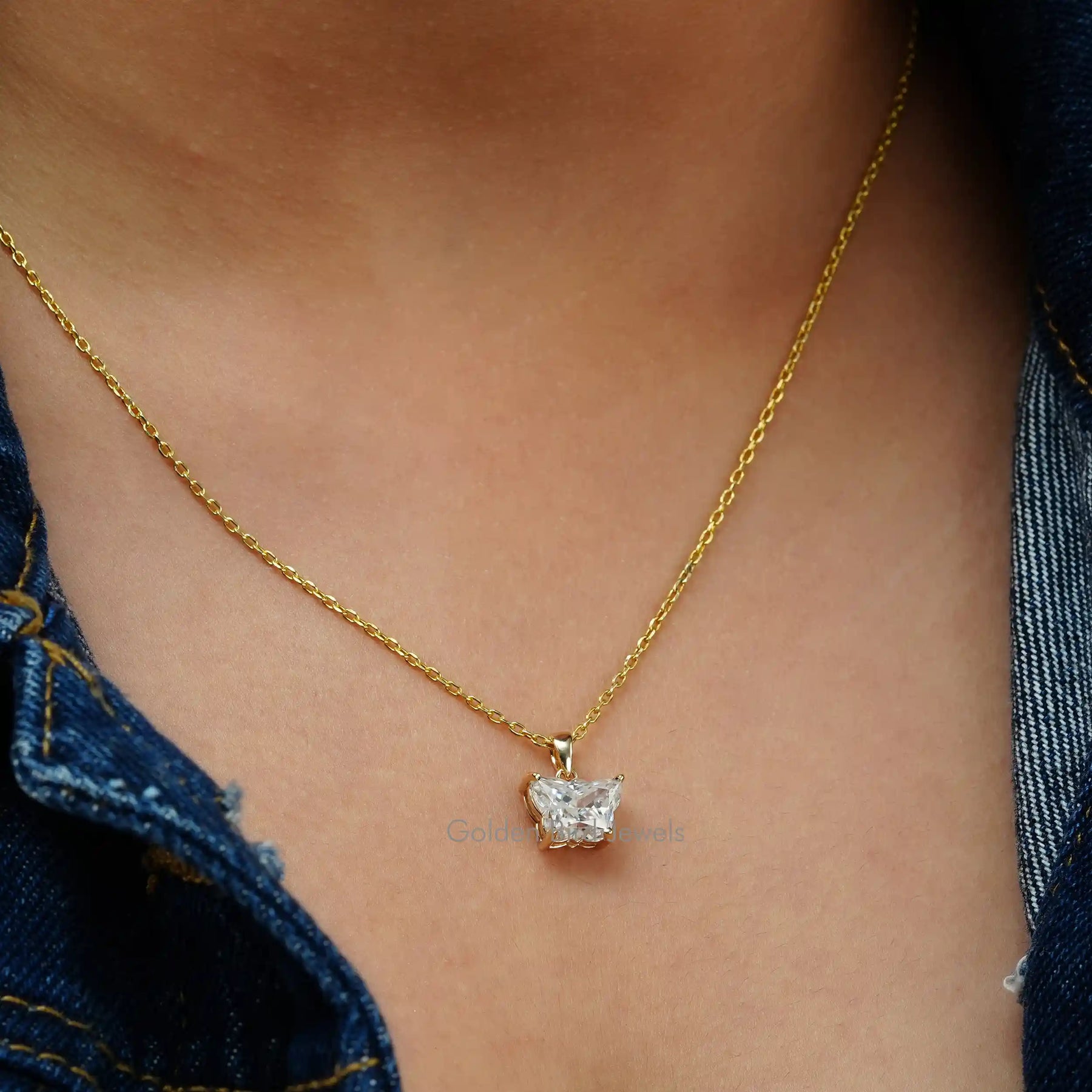 In neck side view of butterfly cut moissanite pendant