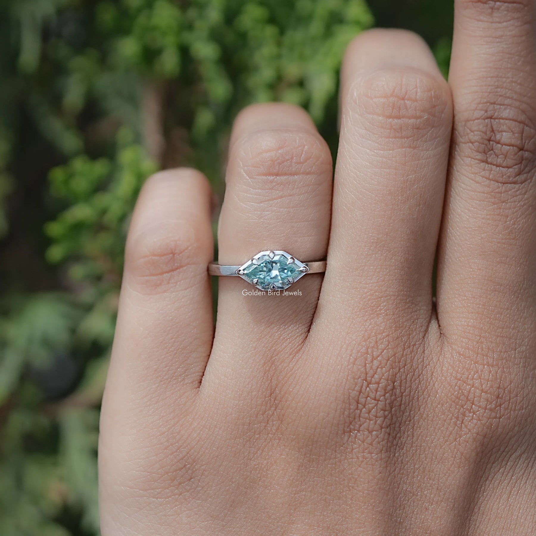 In finger view of Marquise Cut Moissanite Ring