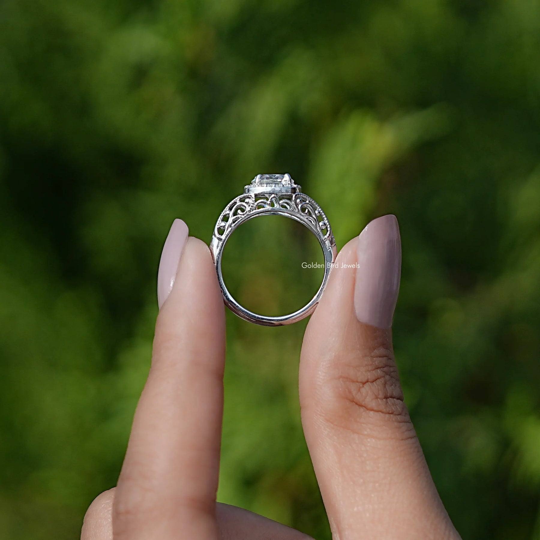 Back View of Moissanite Old Cut European Round Halo Ring In two fingers
