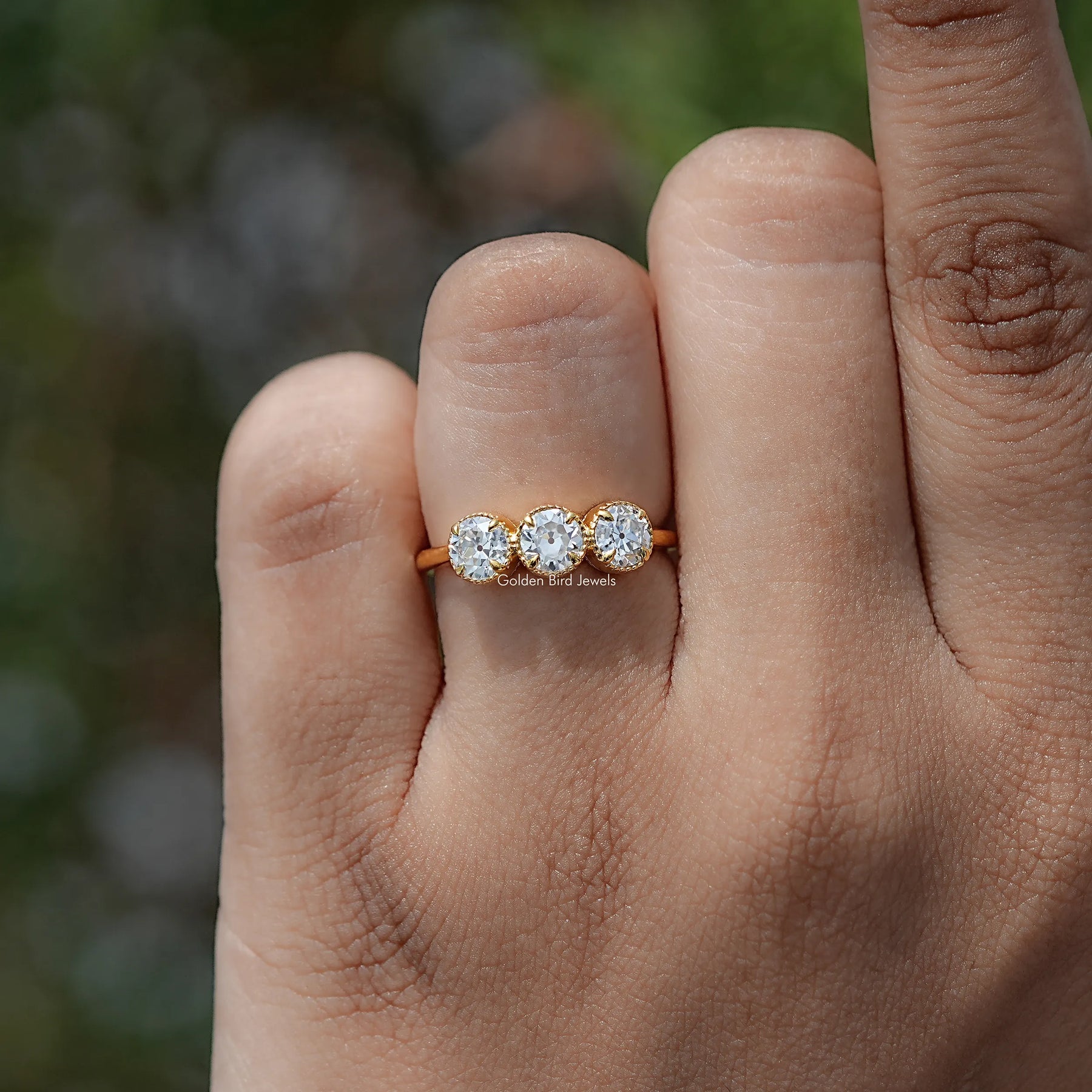 In finger view of European Cut Moissanite Solitaire Ring